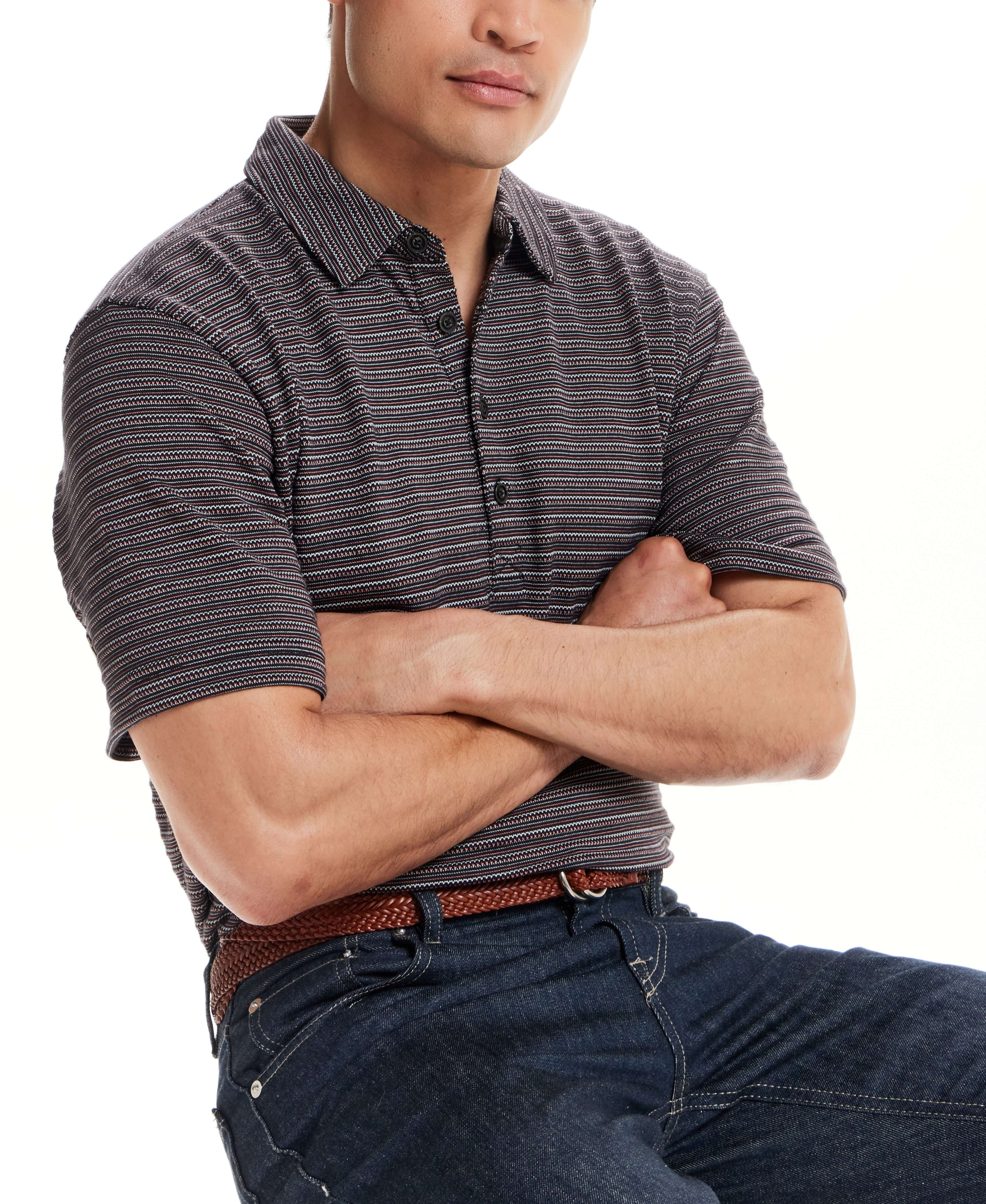 Jacquard Stripe Polo in Black worn by model, showcasing its subtle texture and classic style.