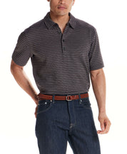 Man wearing a Jacquard Stripe Polo in Black with short sleeves and a three-button placket.