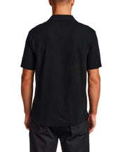 Back view of Seersucker Coatfront Knit in Black showcasing the structured collar and subtle grid texture.