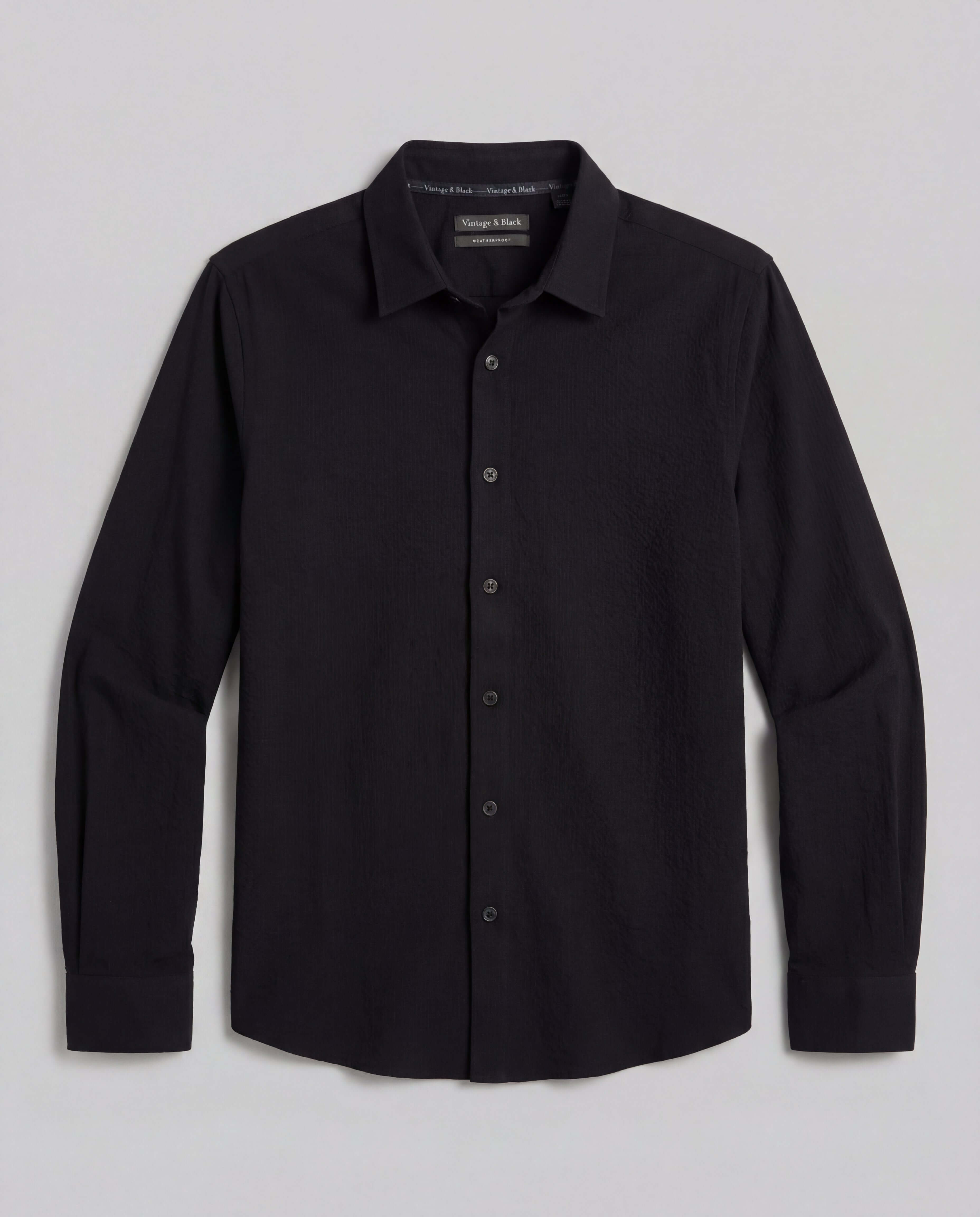 Seersucker Shirt in Black featuring a button-front design and lightweight cotton texture.