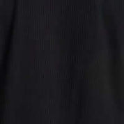 Close-up of the subtle grid texture of the Seersucker Coatfront Knit in Black.