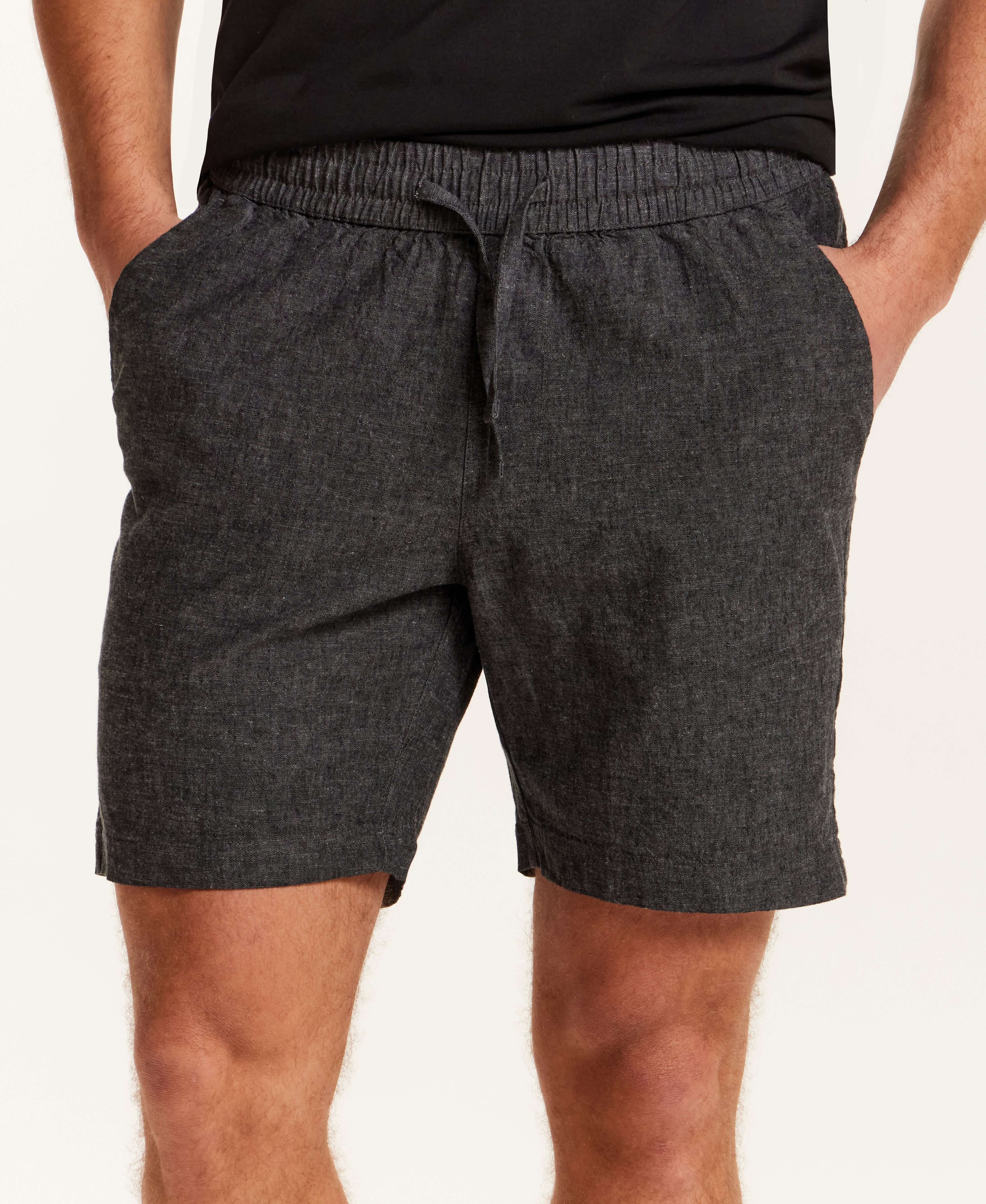 Chambray Stripe Drawstring Short in Black featuring an elastic waistband and side pockets, perfect for warm days.