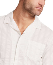 Cotton Dobby Seersucker Shirt in White displayed on a model, showcasing its camp collar and chest pocket.