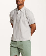 Cotton Gauze Herringbone Polo in Vapor Grey worn by a male model, featuring short sleeves and a three-button placket.