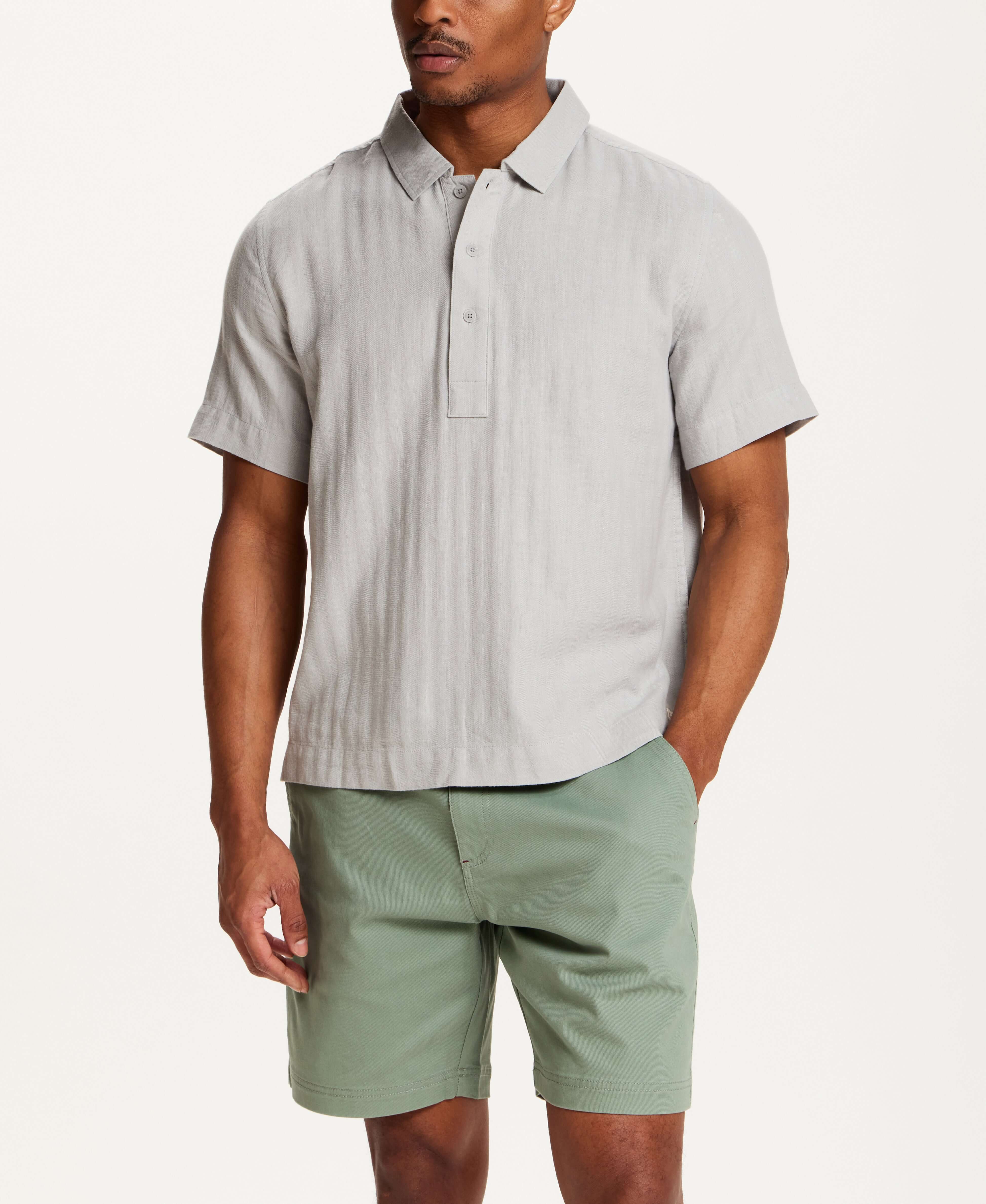 Cotton Gauze Herringbone Polo in Vapor Grey worn with light green shorts, showcasing a relaxed fit and classic collar.