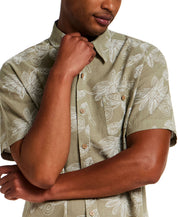 100% Cotton Linen-Texture Shirt in Sea Grass worn by model, featuring short sleeves and floral pattern.