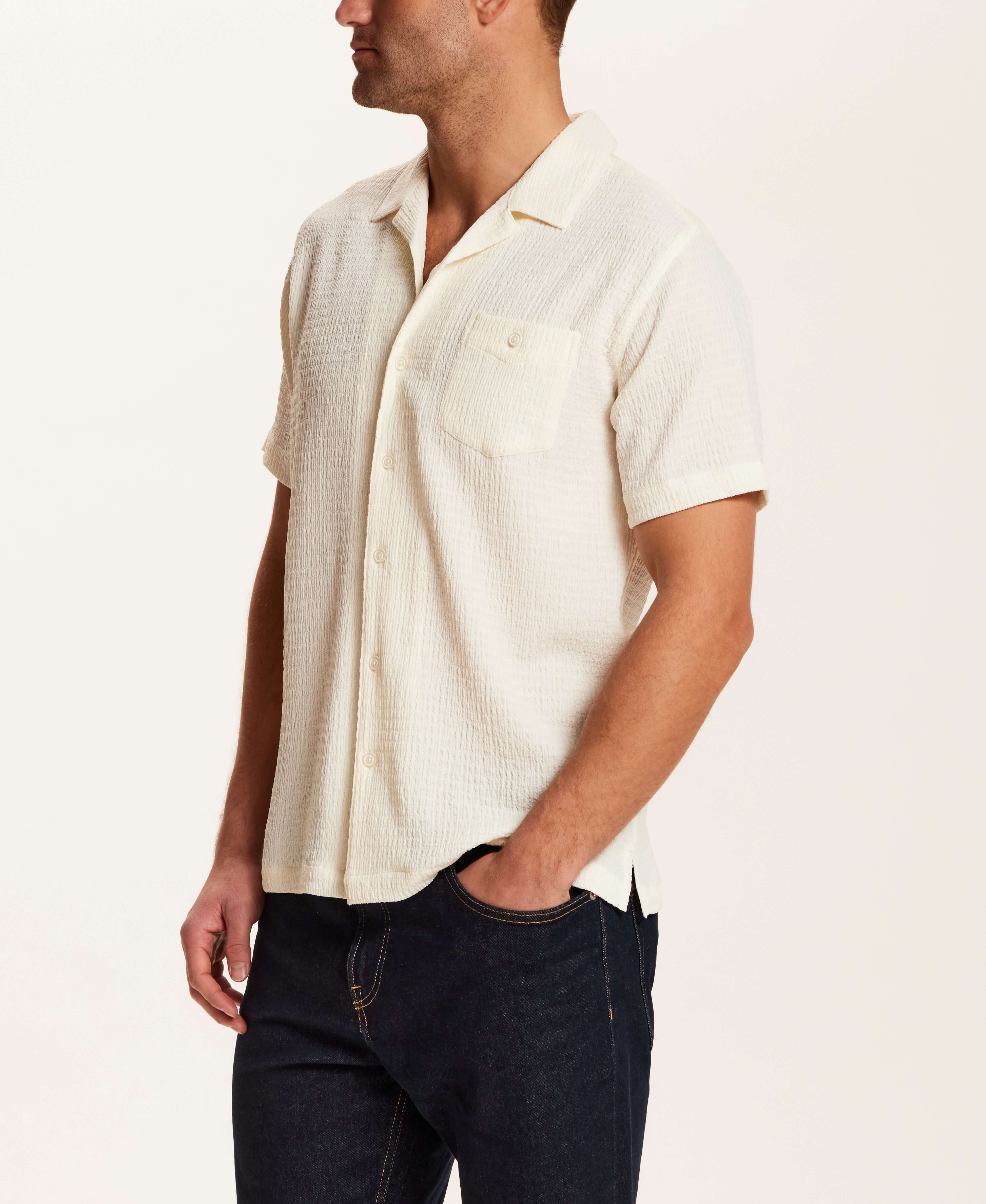 Crinkle Texture Camp Collar Shirt in Cream displayed on a model, highlighting its lightweight fabric and relaxed fit.