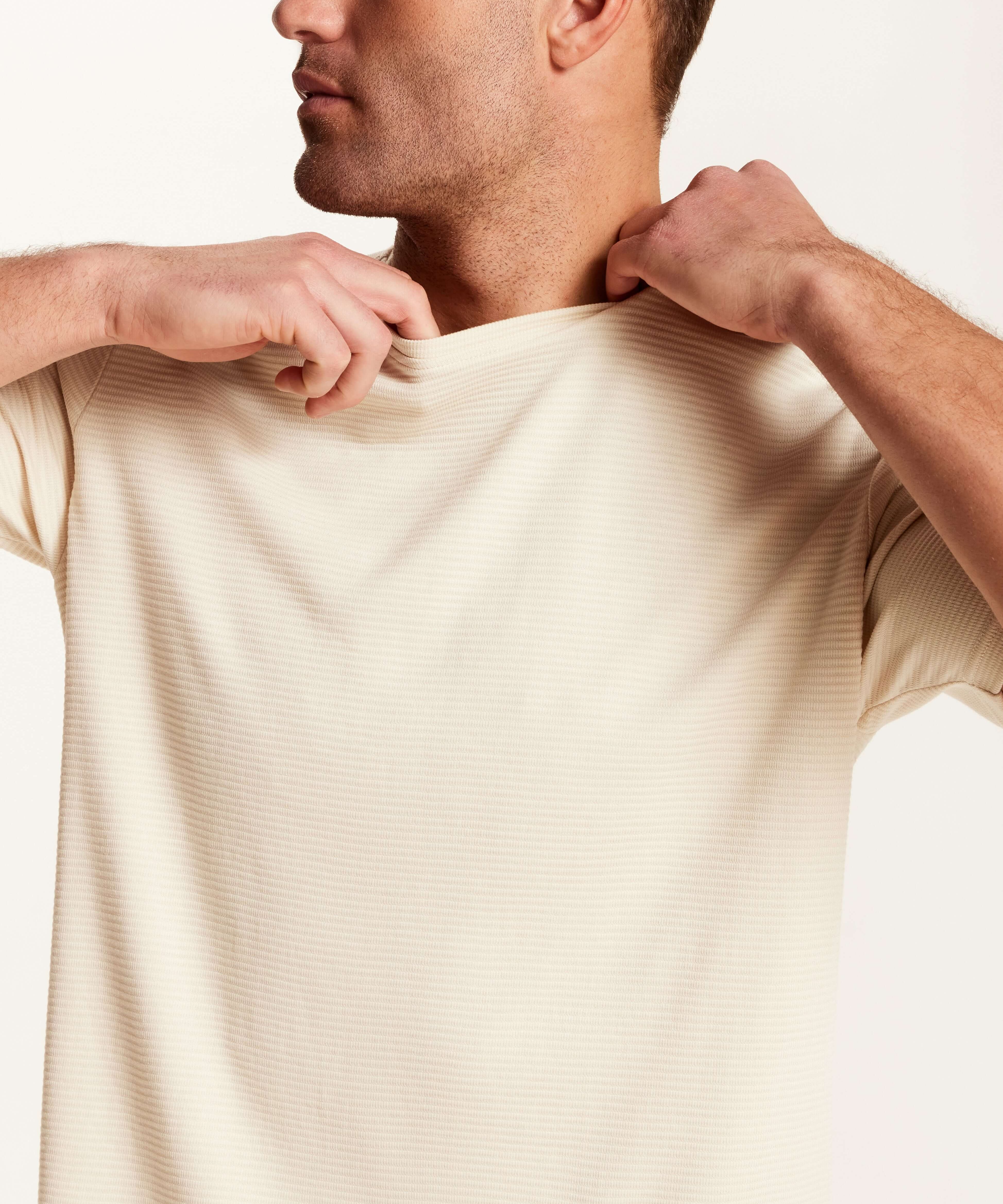 Model wearing a Horizontal Rib Tee in Cream, showcasing the subtle ribbing and lightweight fabric.