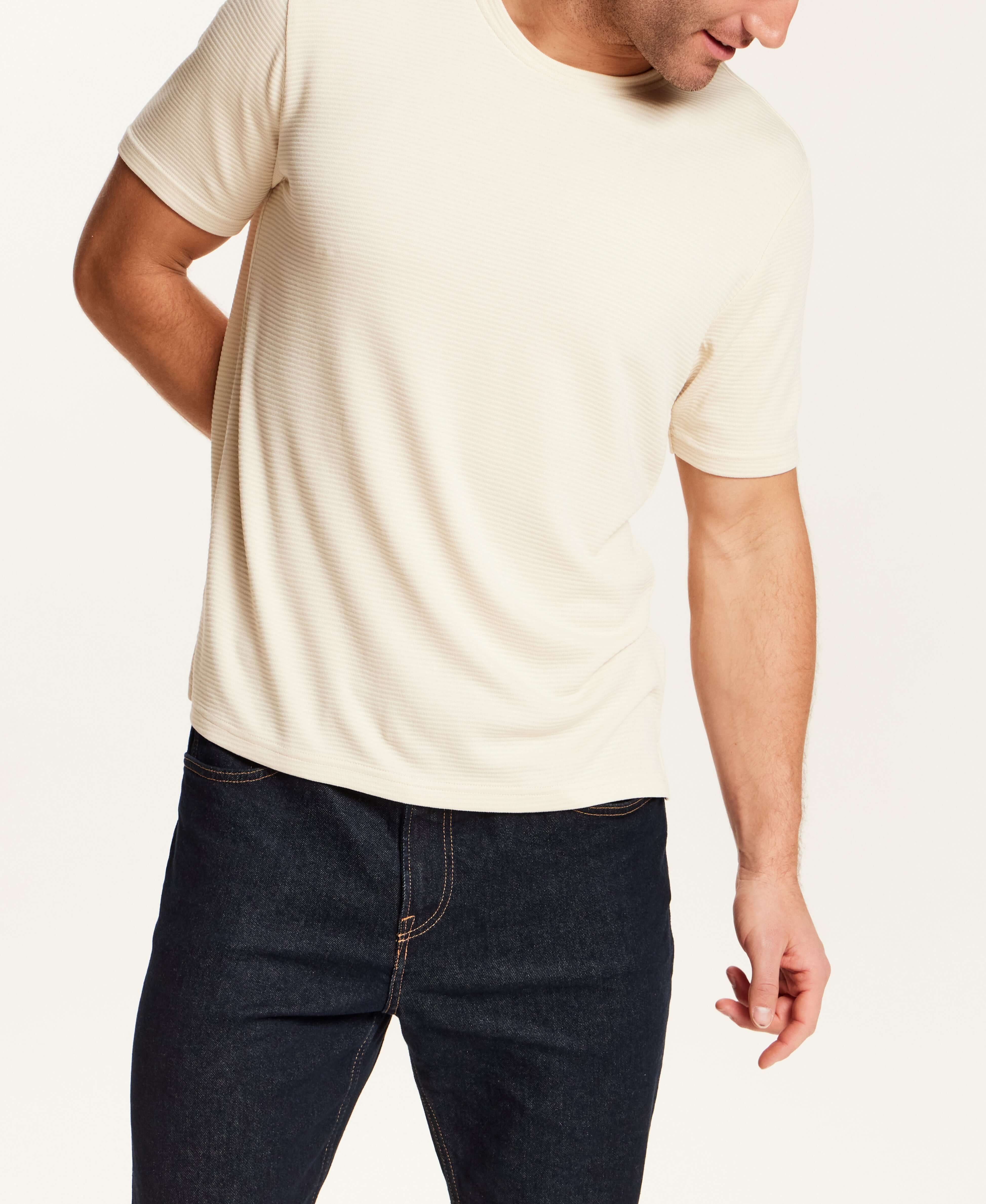 Horizontal Rib Tee in Cream worn by a model, featuring a soft modal blend and crew neckline.
