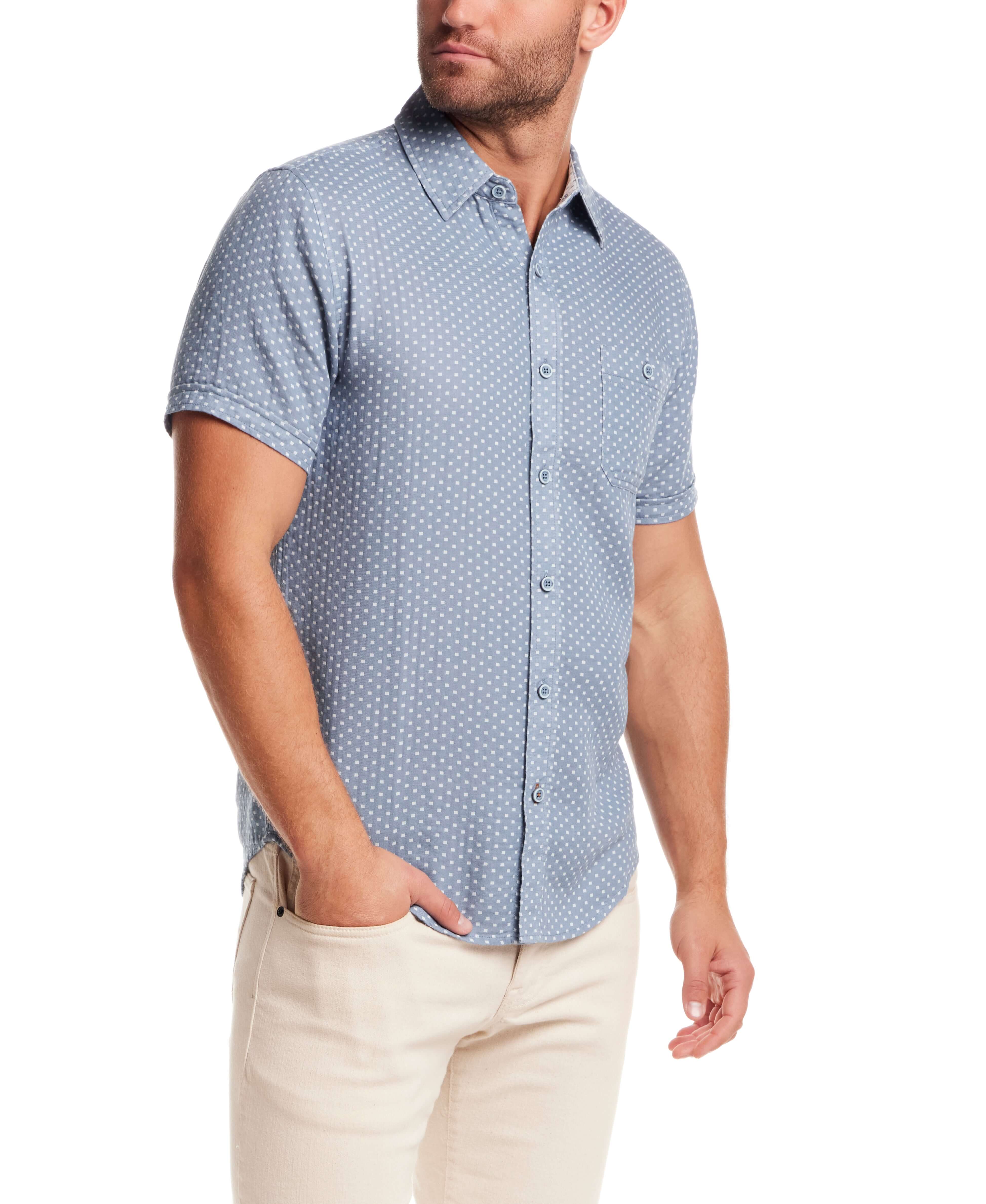 Double Layer Dobby Short Sleeve Shirt in Dusty Blue worn by a model with cuffed short sleeves and button closure.