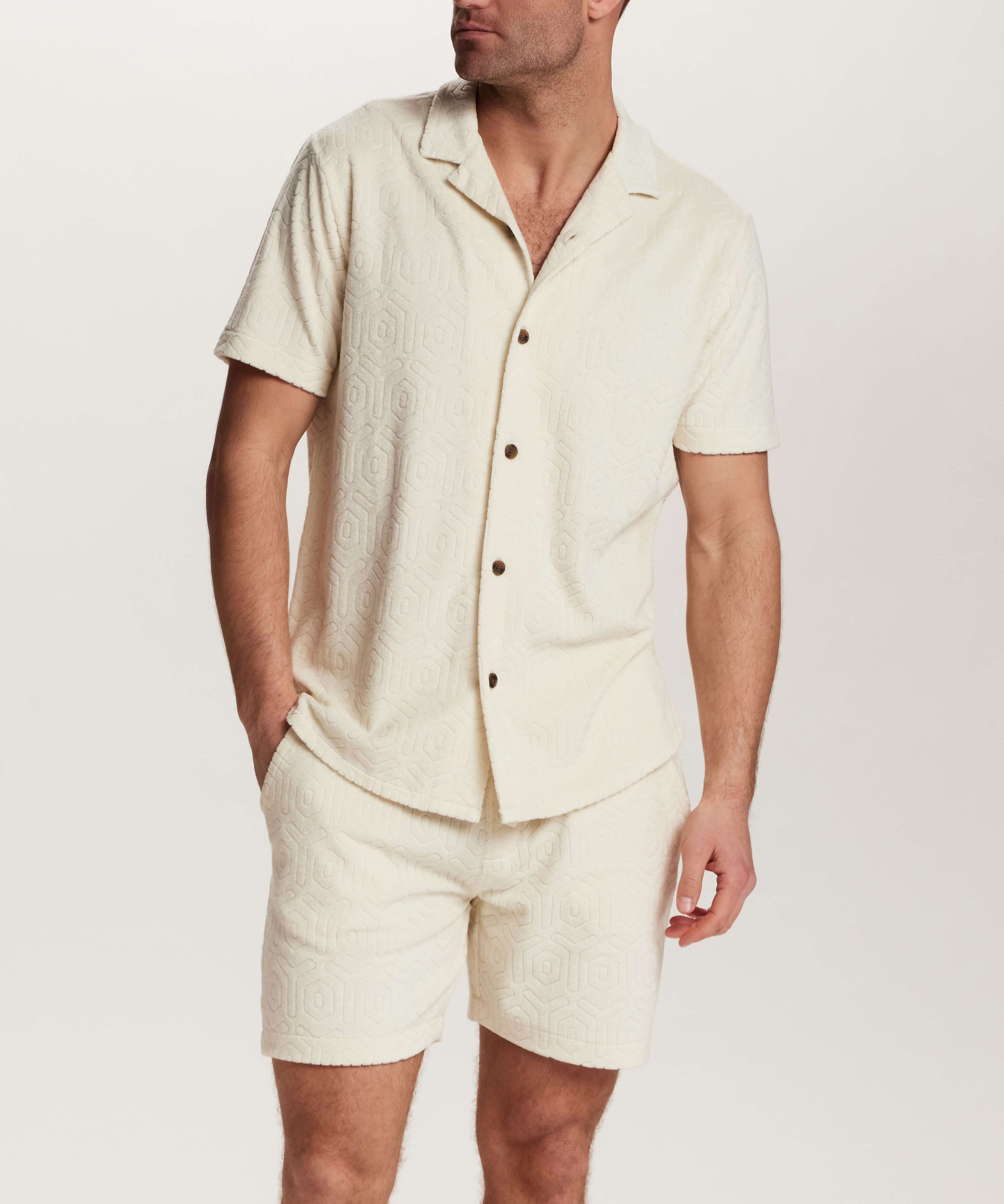 Geometric Terry Camp Shirt in Stone worn with matching shorts, showcasing soft terry fabric and relaxed camp collar.