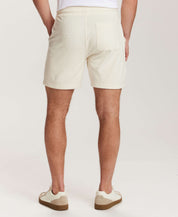 Geometric Terry Drawstring Short in Stone, showing back view with subtle geometric pattern and side slash pockets.