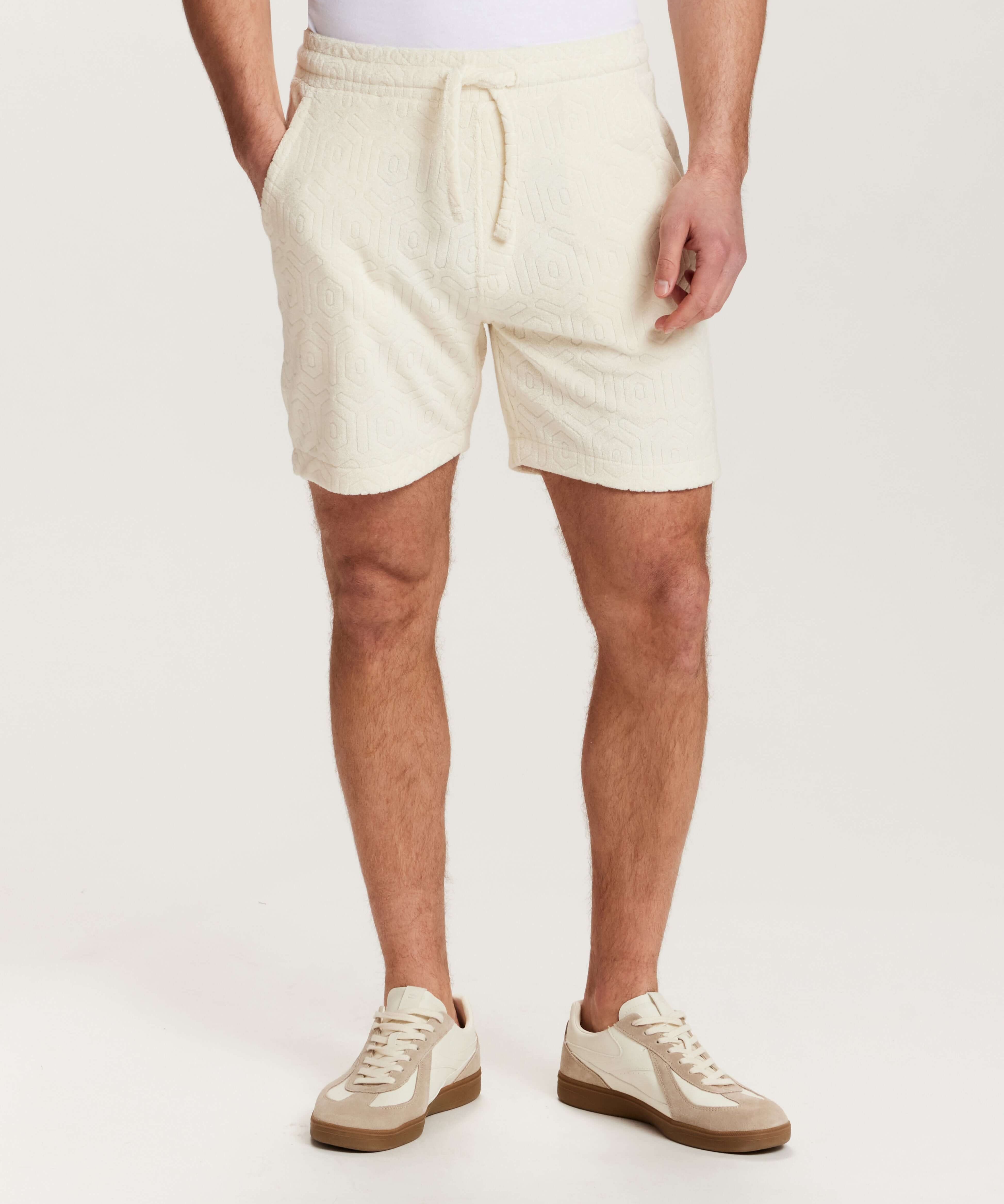 Geometric Terry Drawstring Short in Stone, featuring soft fabric and side pockets for a comfortable fit.