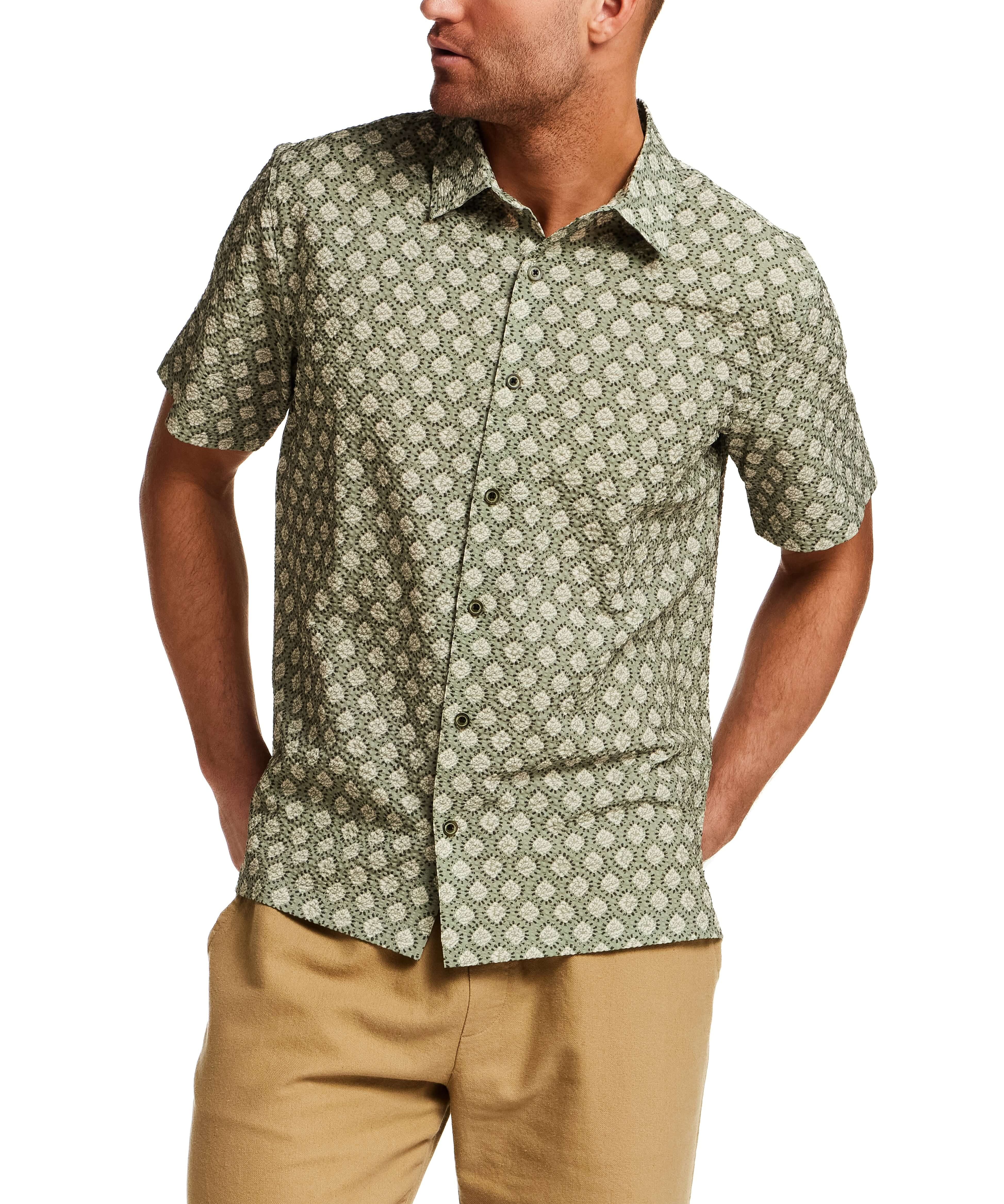 The Medallion Print Seersucker Shirt in Green worn by a model, showcasing its subtle texture and refined design.