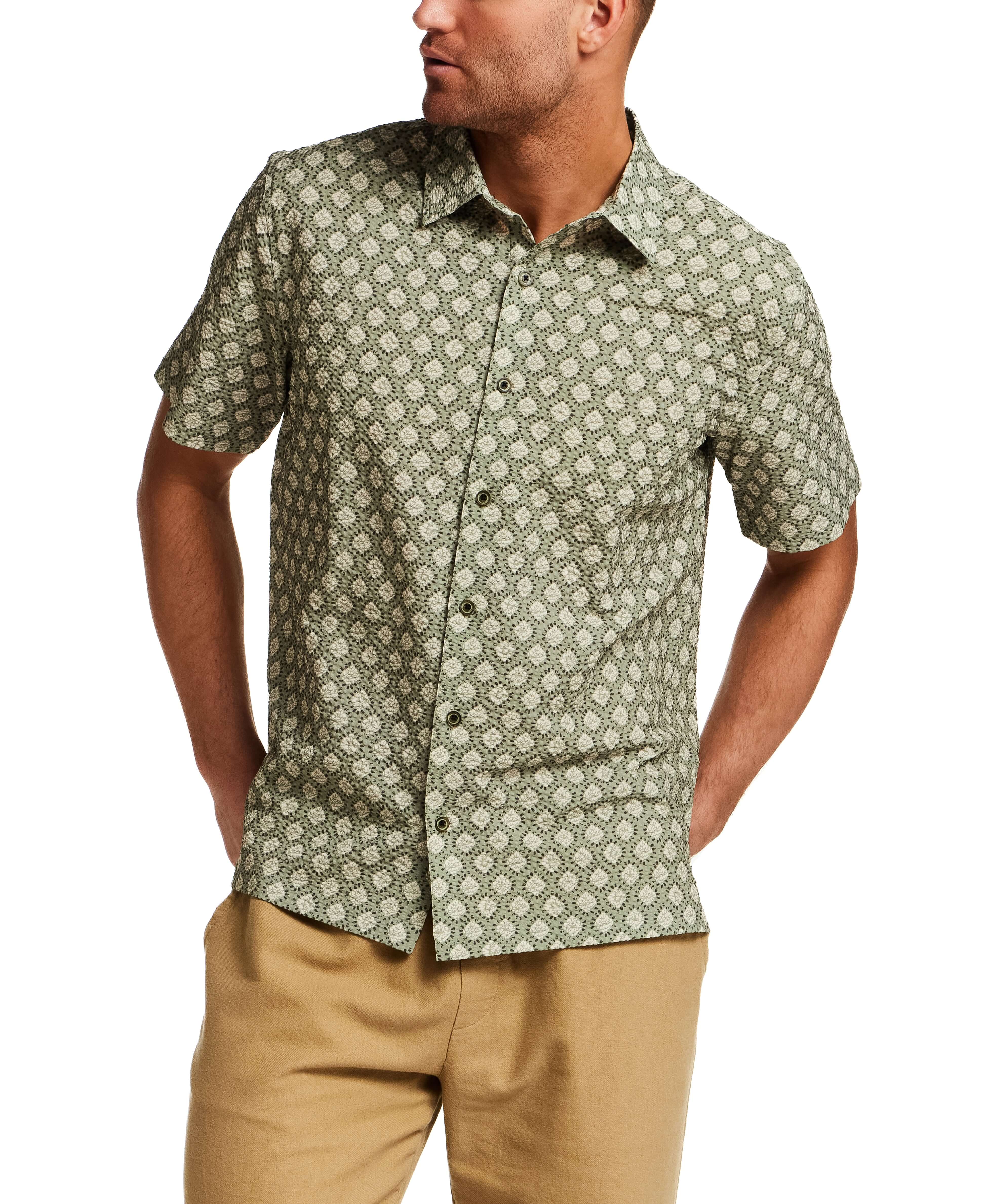The Medallion Print Seersucker Shirt in Green worn by a model, showcasing its subtle texture and refined design.