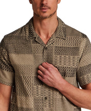 Jacquard Resort Shirt in Khaki shown on model, featuring textured fabric and relaxed fit for a stylish vacation outfit.