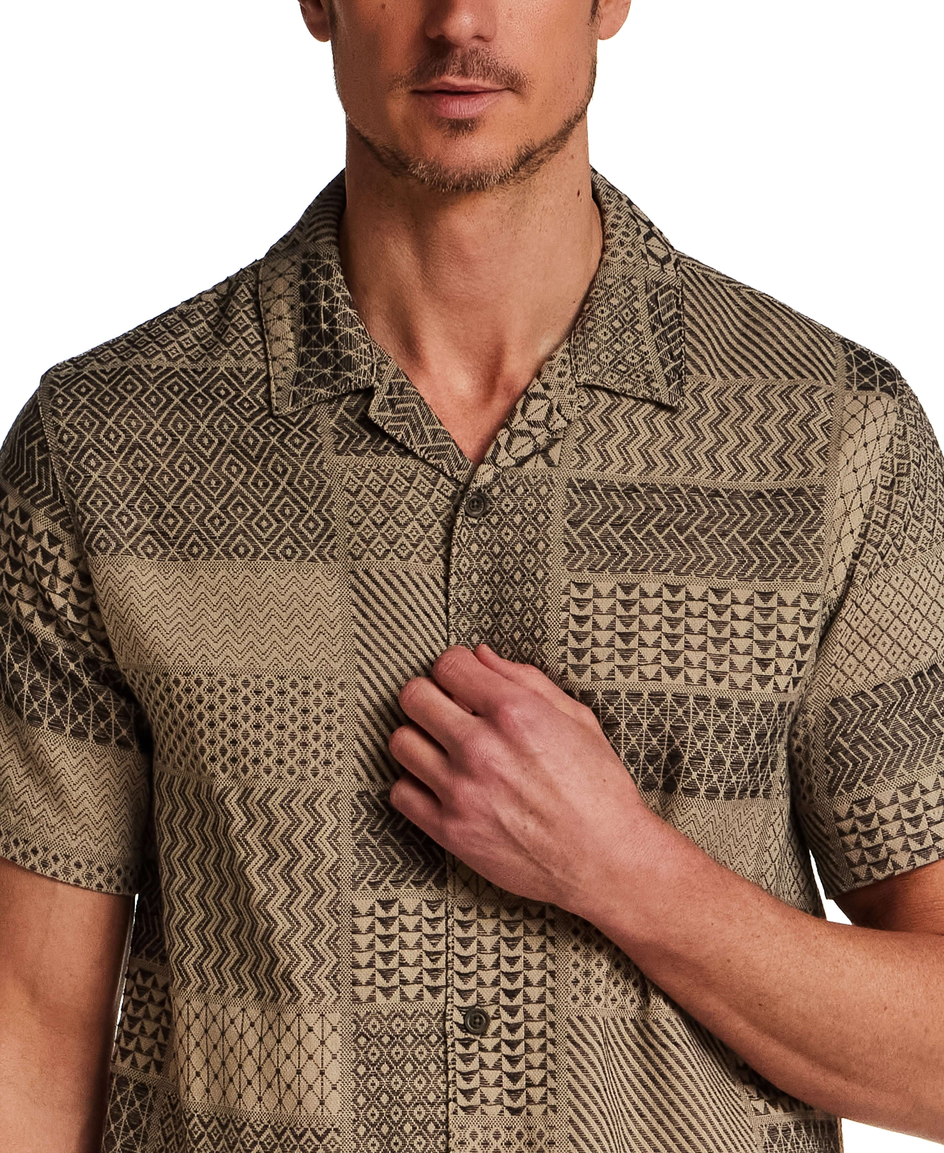 Jacquard Resort Shirt in Khaki shown on model, featuring textured fabric and relaxed fit for a stylish vacation outfit.