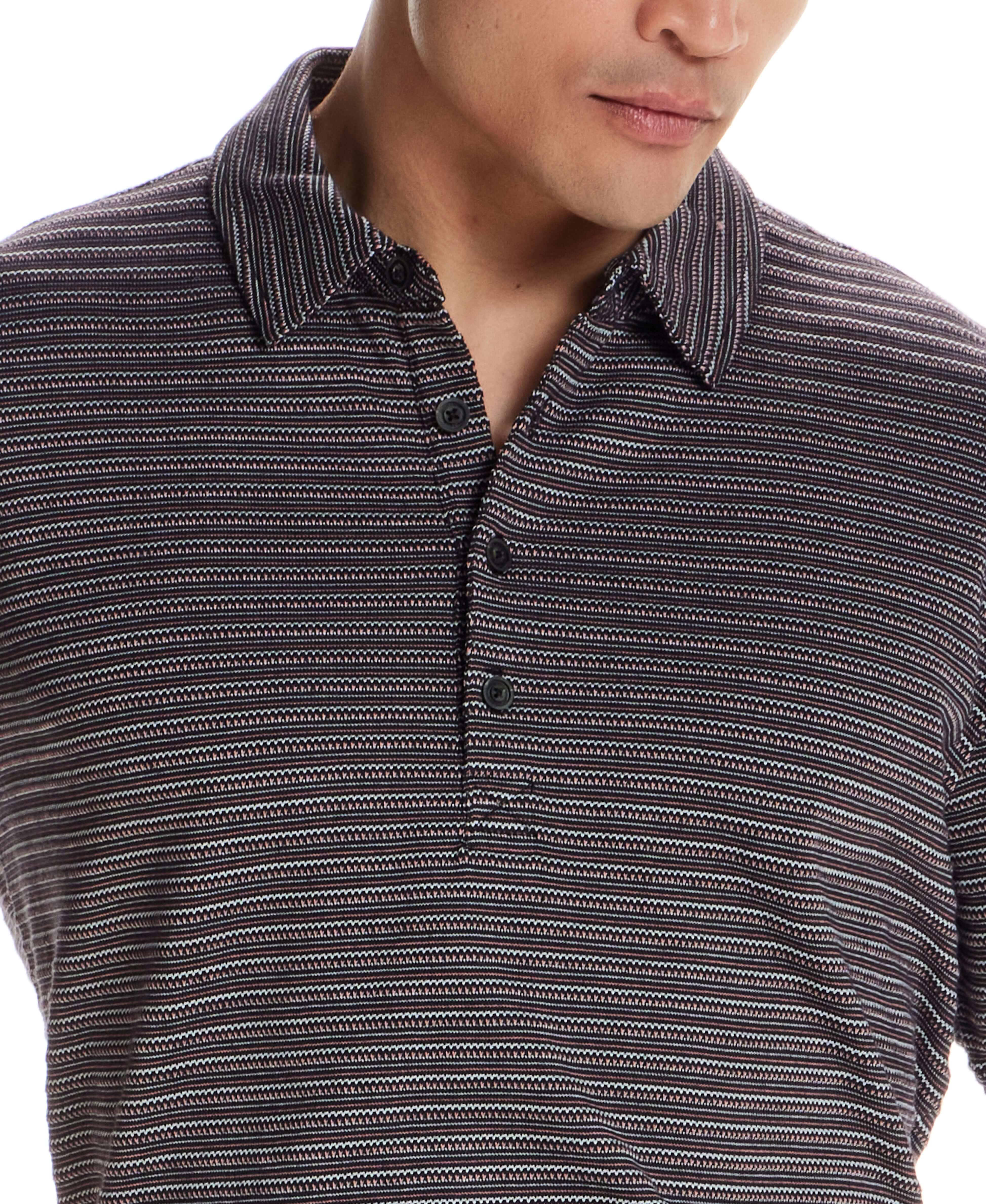 Model wearing the Jacquard Stripe Polo in Black, showcasing jacquard striping and a structured collar.