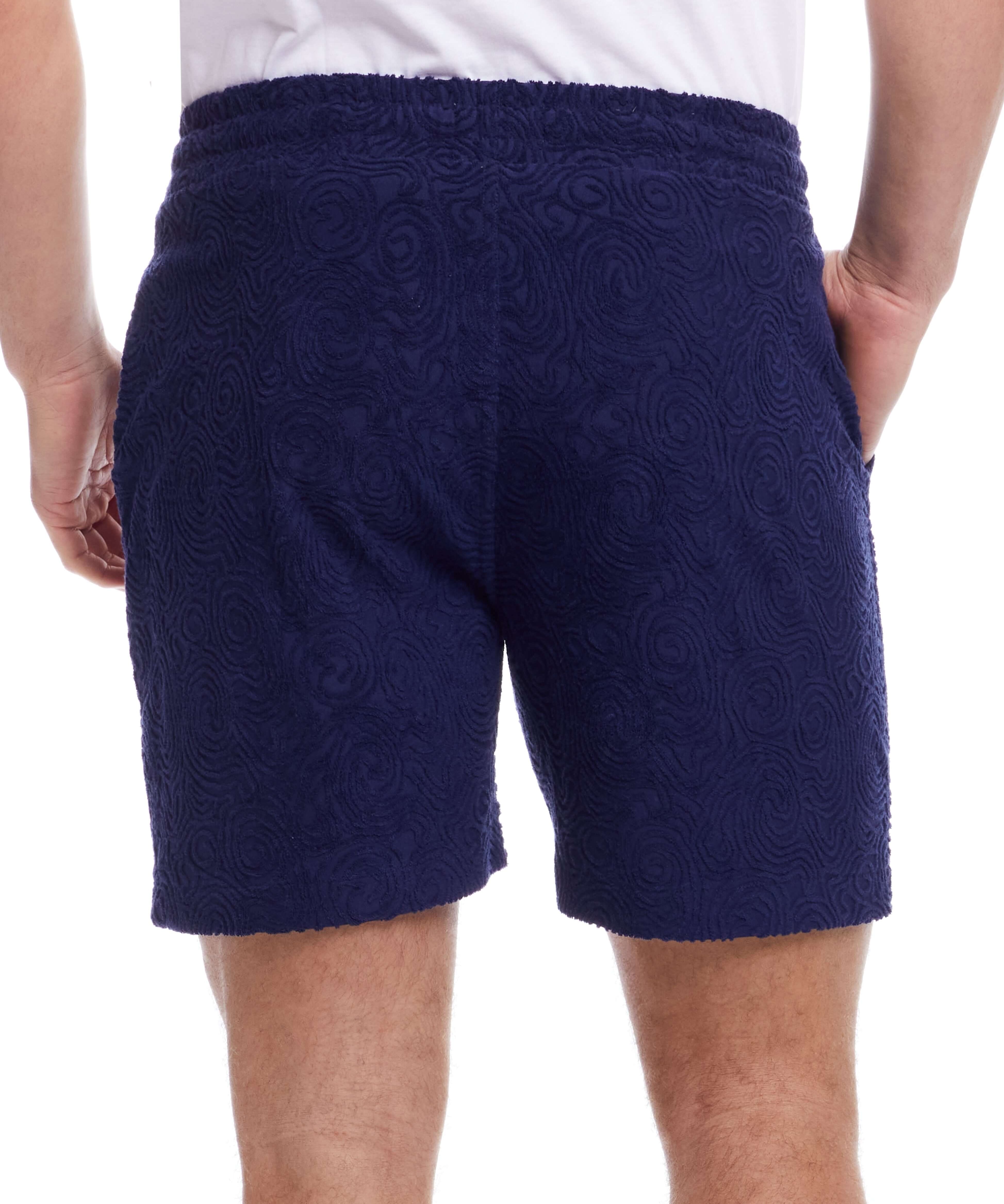 Back view of Jacquard Terry Knit Shorts in Navy, featuring textured fabric and an elastic waistband.