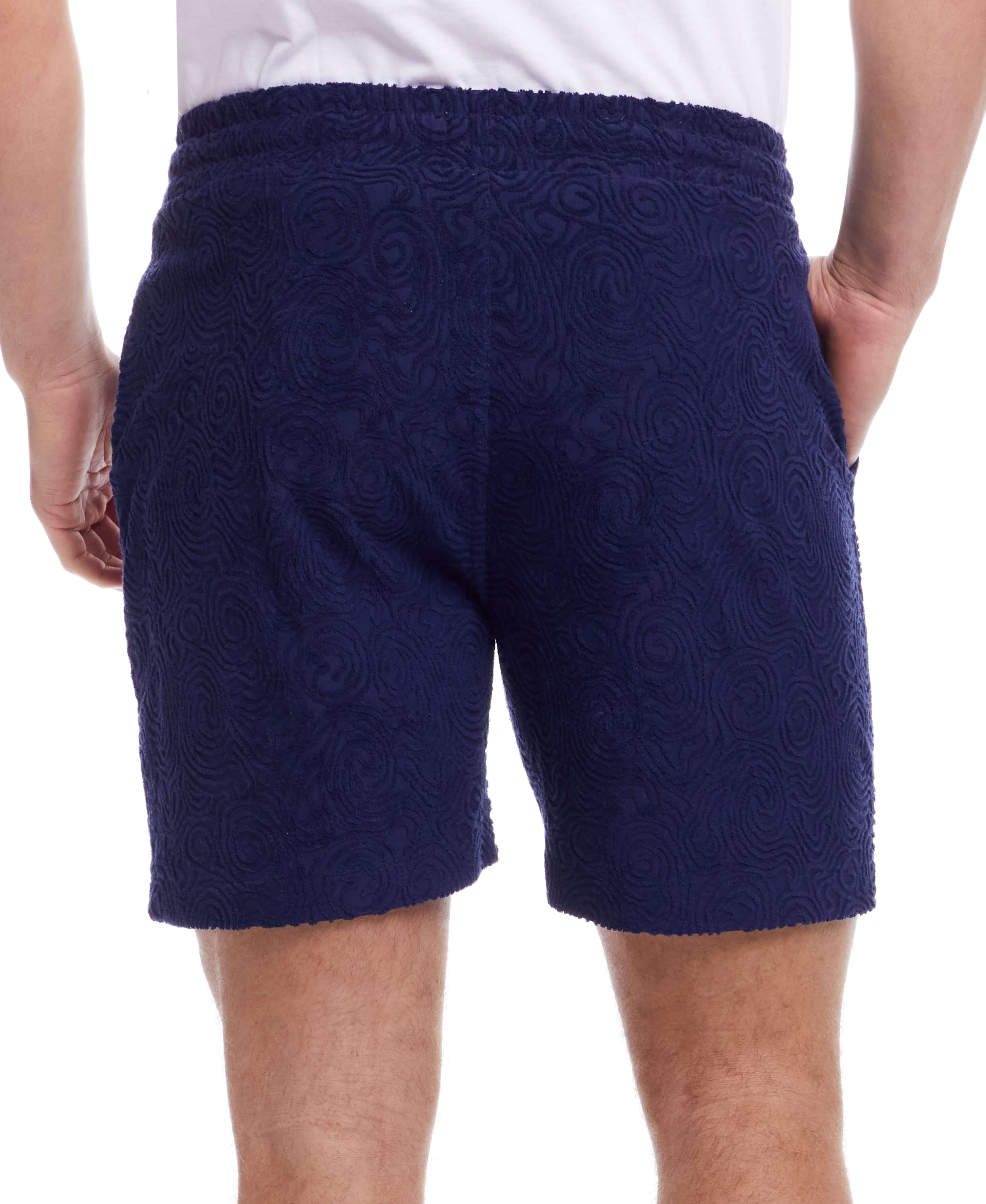 Back view of Jacquard Terry Knit Shorts in Navy, featuring textured fabric and an elastic waistband.
