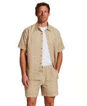 The Medallion Print Seersucker Short in Khaki worn with matching shirt, showcasing elastic waistband and floral print.