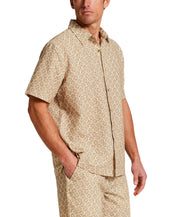 The Medallion Print Seersucker Shirt in Khaki worn by a model, showcasing its textured fabric and stylish design.