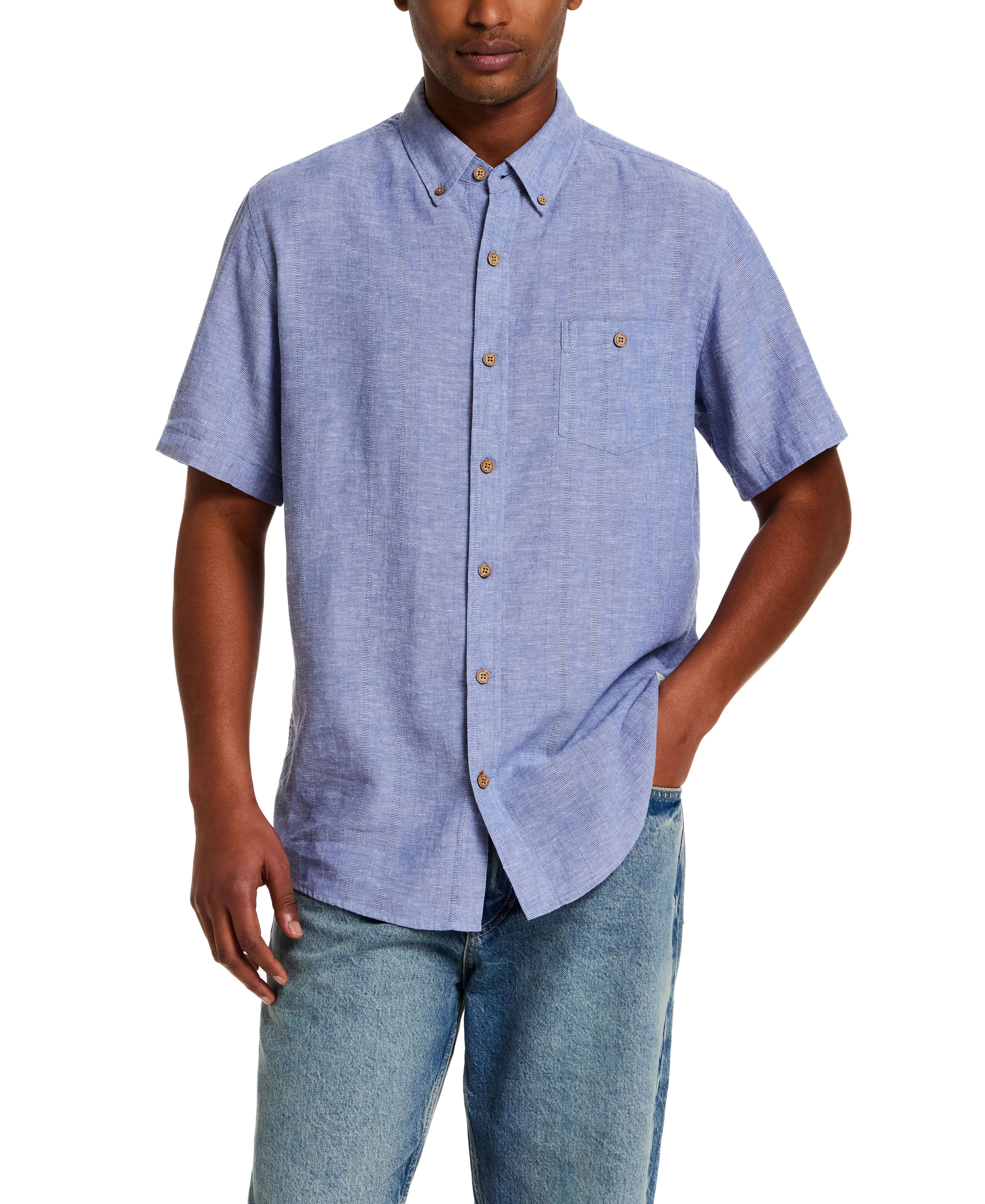 Linen Blend Dobby Stripe Shirt in Infinity Blue worn by a model, featuring a button front and short sleeves.