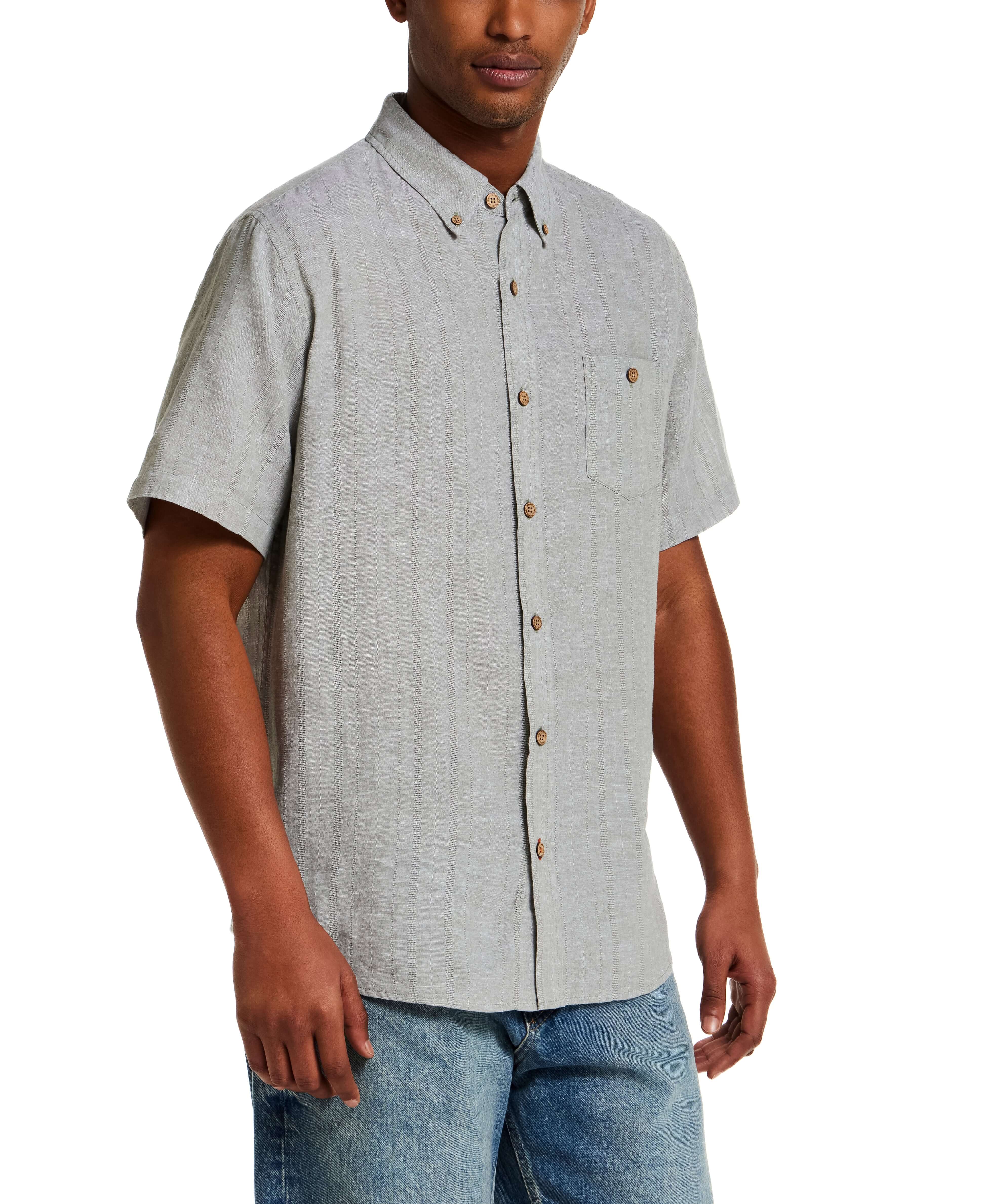 Linen Blend Dobby Stripe Shirt in Sea Grass worn by a model. Lightweight, breathable shirt with short sleeves and chest pocket.