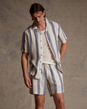 Linen Blend Vertical Stripe Shorts in Blue White Stripe worn with matching top, featuring vertical stripes and elastic waist.