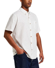 The Linen Cotton Print Shirt in Snow White displayed on a model wearing size Large, featuring a relaxed fit and abstract floral print.