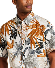 The Linen Cotton Print Shirt in Khaki features a relaxed fit, short sleeves, and abstract floral print design.