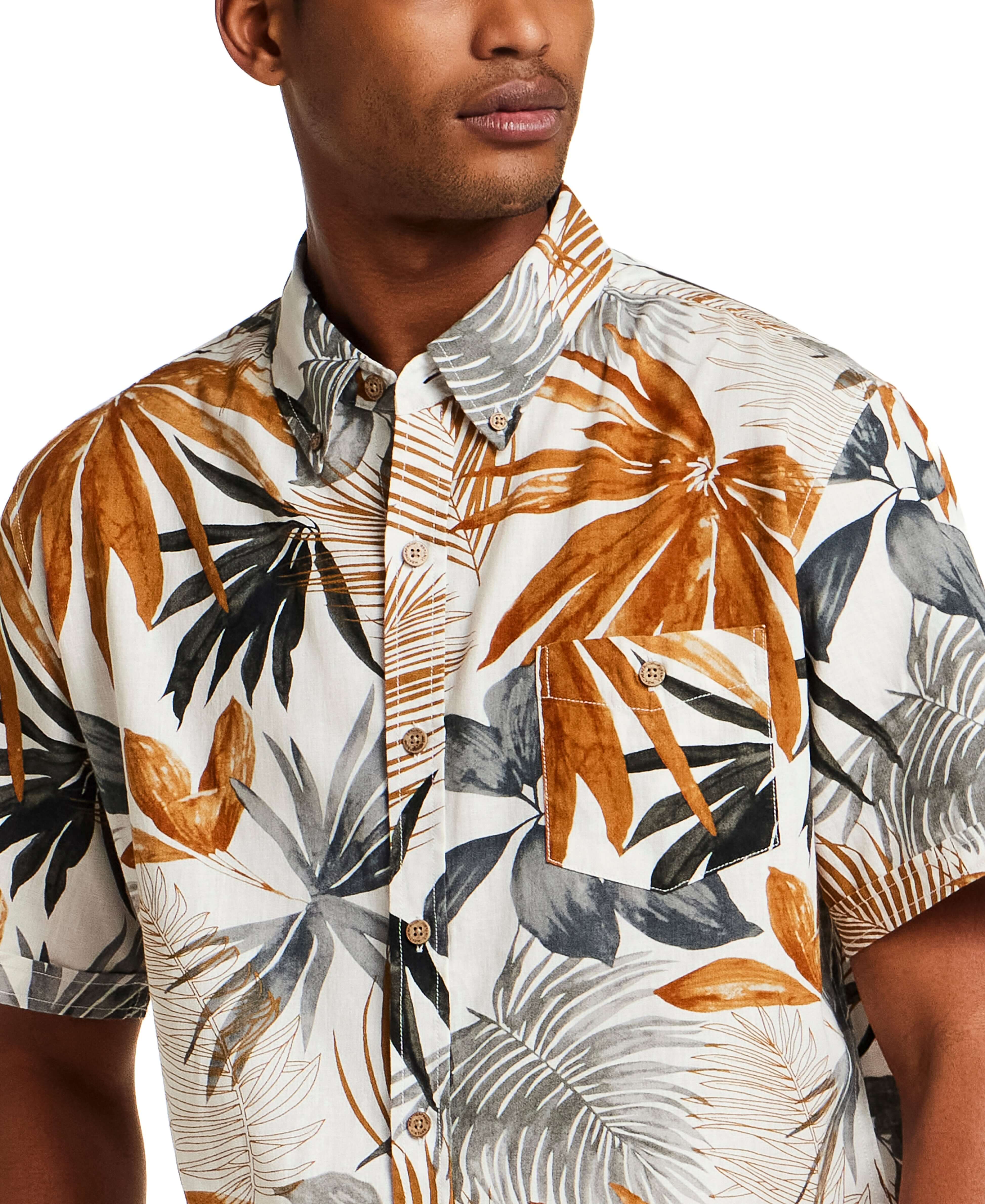 The Linen Cotton Print Shirt in Khaki features a relaxed fit, short sleeves, and abstract floral print design.