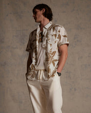 The Linen Cotton Print Shirt in Peanut worn by model, showcasing abstract floral design and relaxed fit.