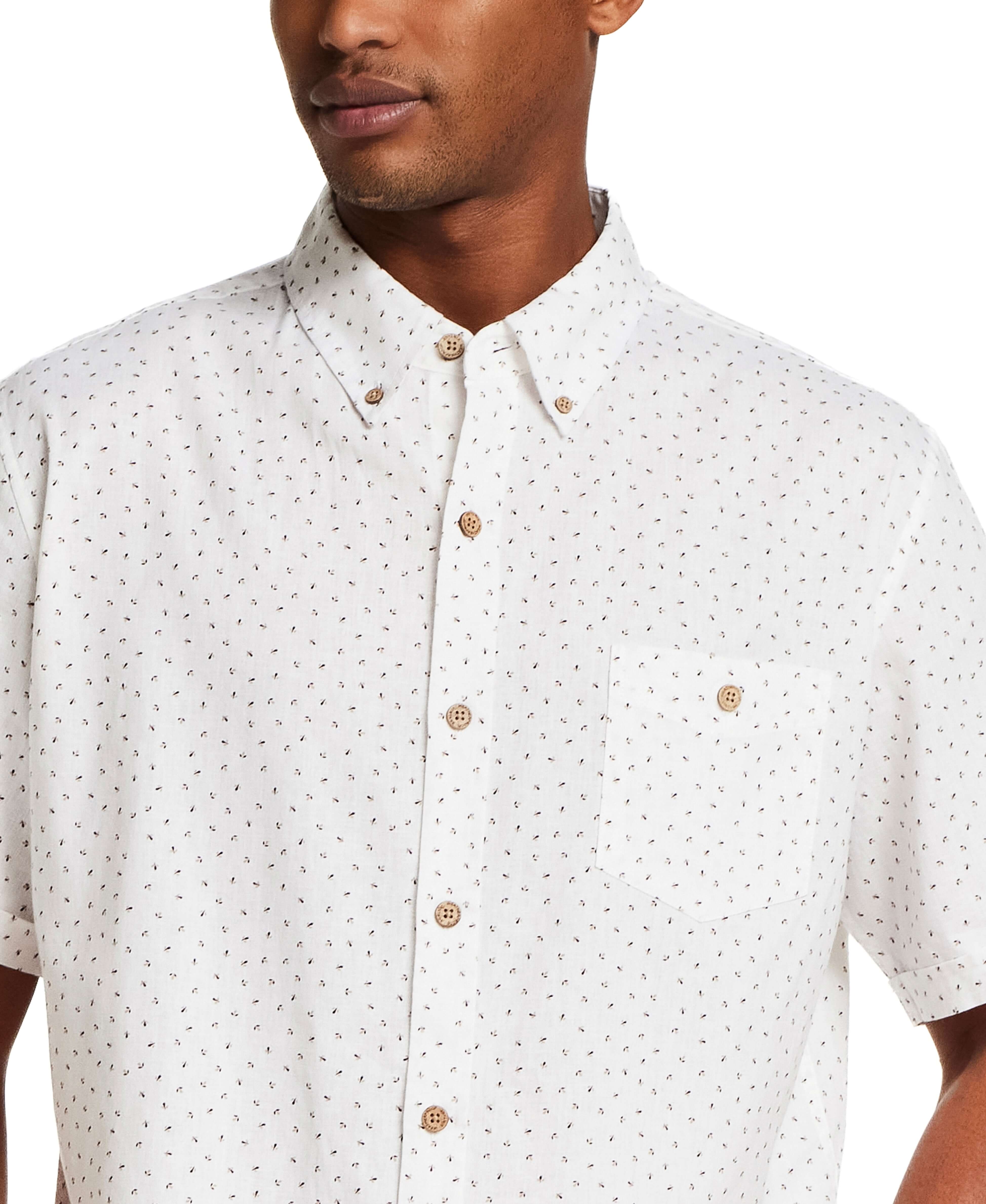 The Linen Cotton Print Shirt in Snow White featuring an abstract floral pattern, button-down style, and relaxed fit.