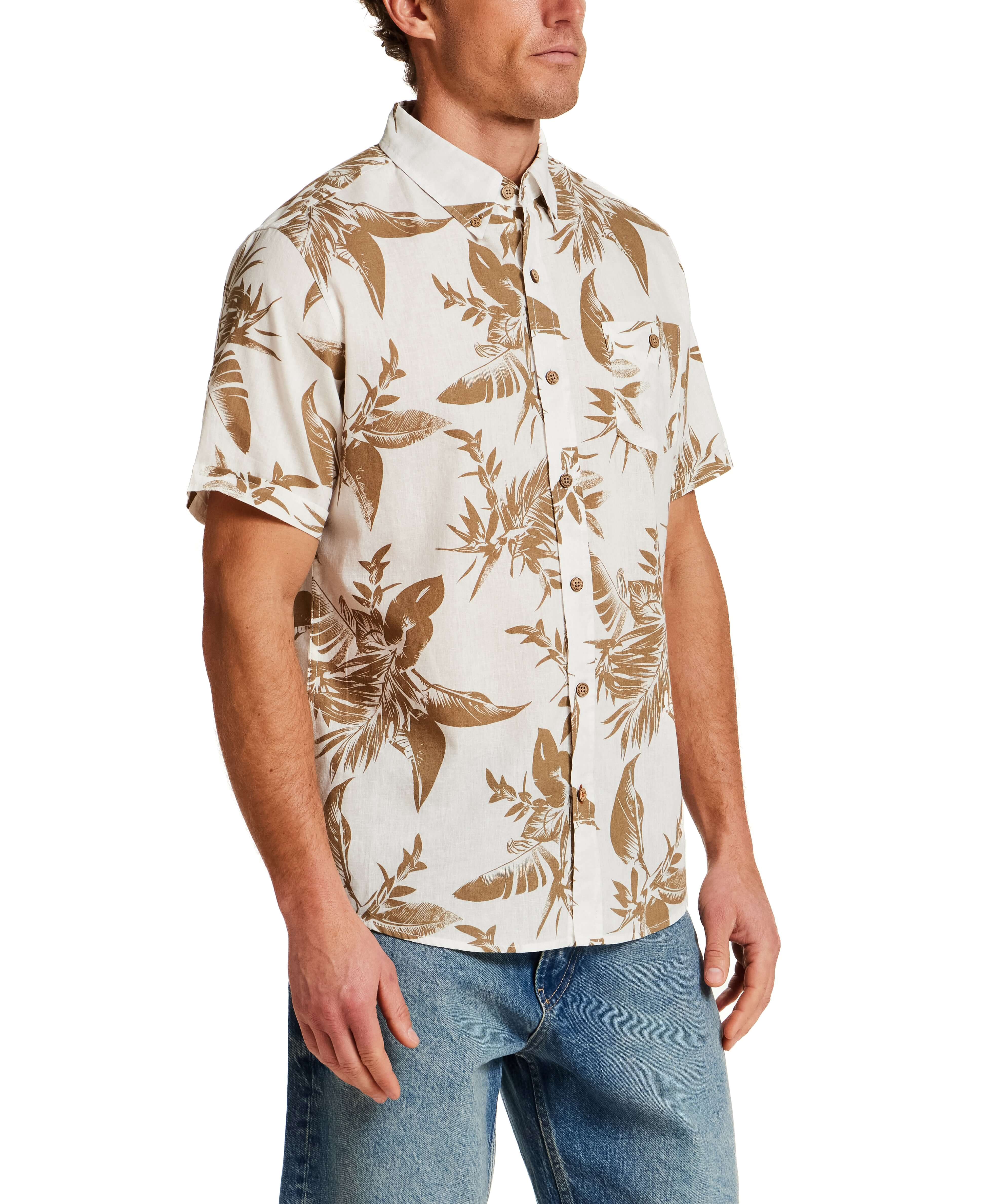 The Linen Cotton Print Shirt in Peanut worn by a model, showcasing its relaxed fit and abstract floral design.