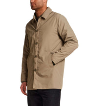 Mid Length Commuter Trench in Khaki worn by a man, showcasing its clean lines and tailored cut.