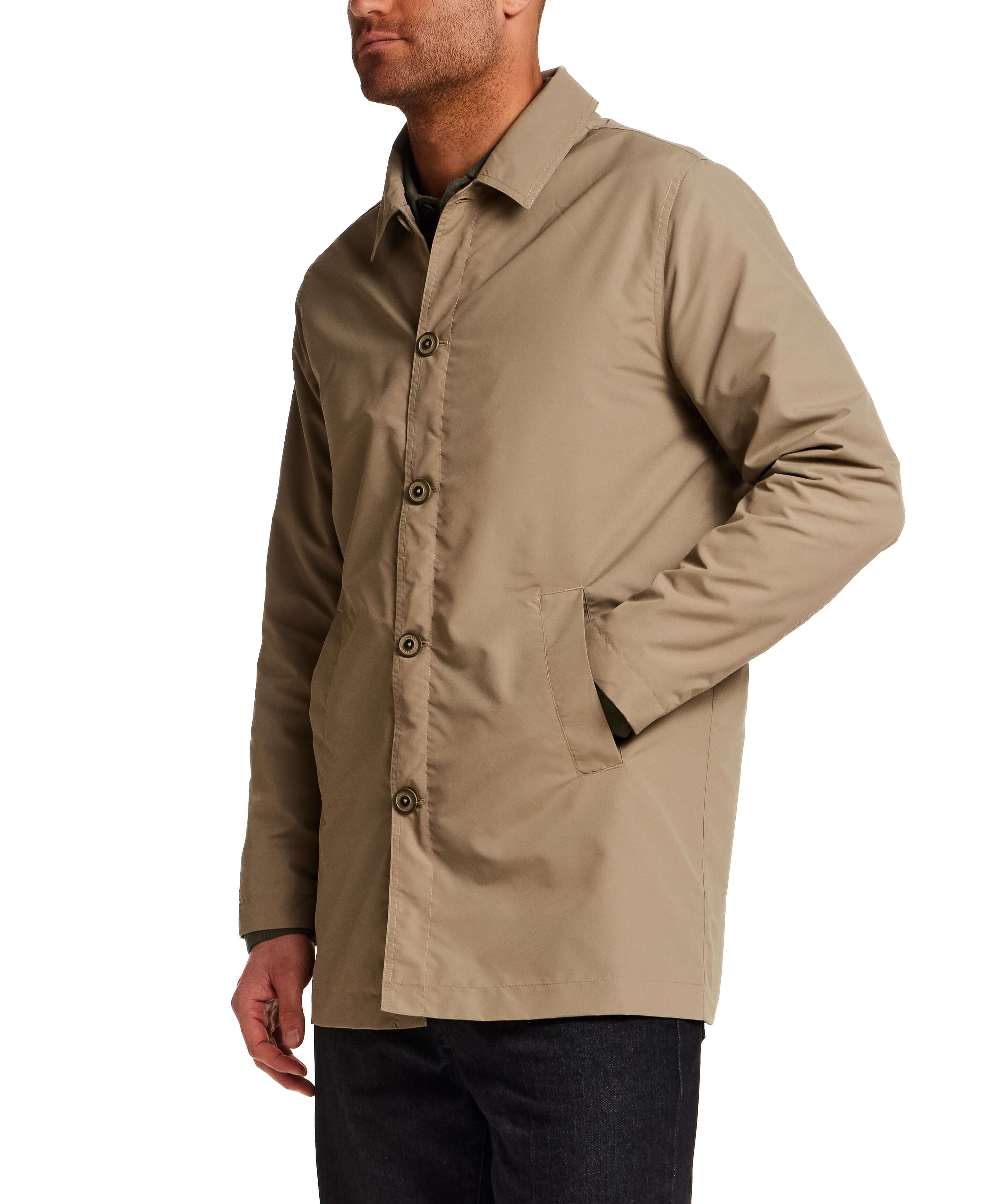 Mid Length Commuter Trench in Khaki worn by a man, showcasing its clean lines and tailored cut.