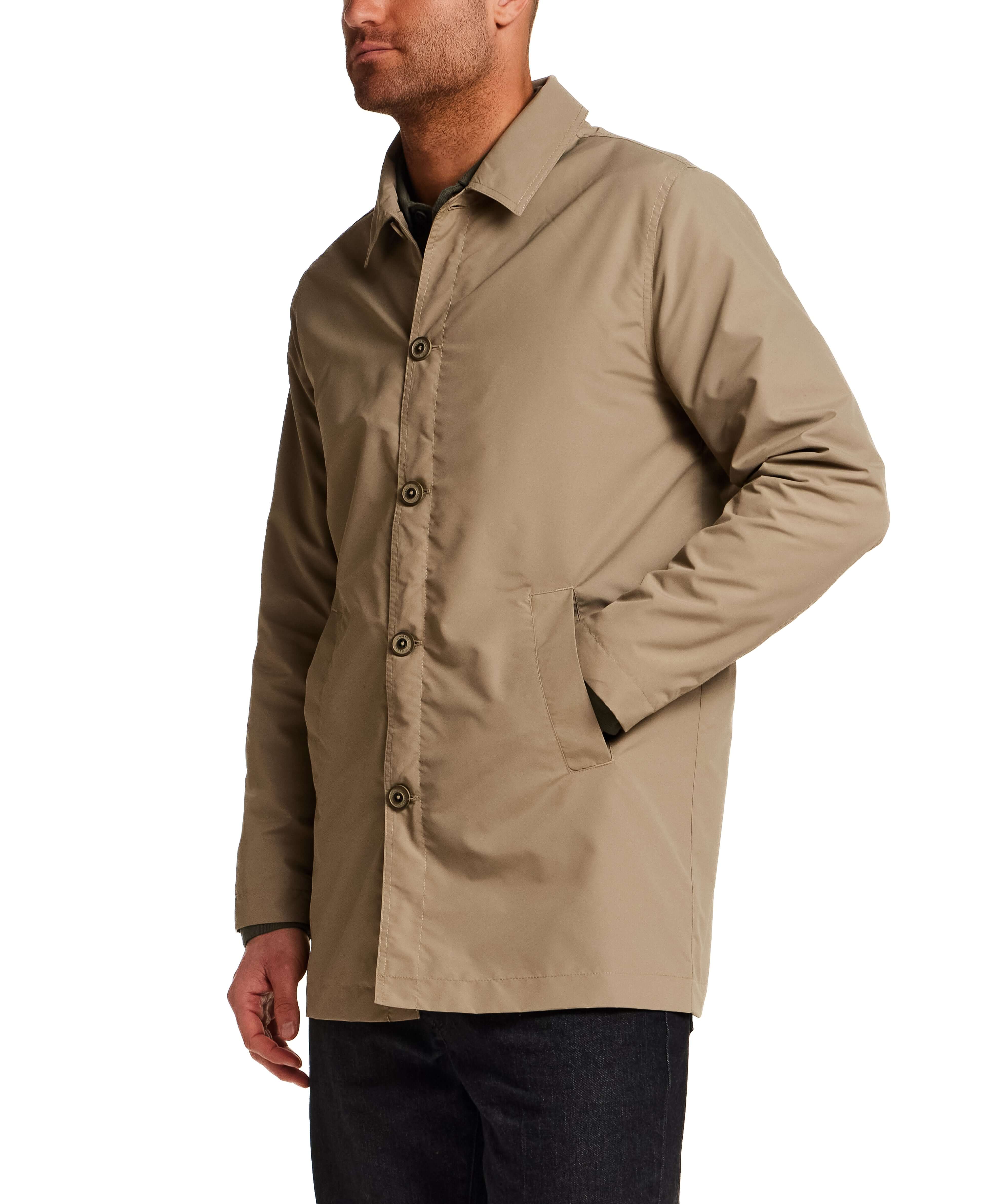 Mid Length Commuter Trench in Khaki worn by a man, showcasing its clean lines and tailored cut.