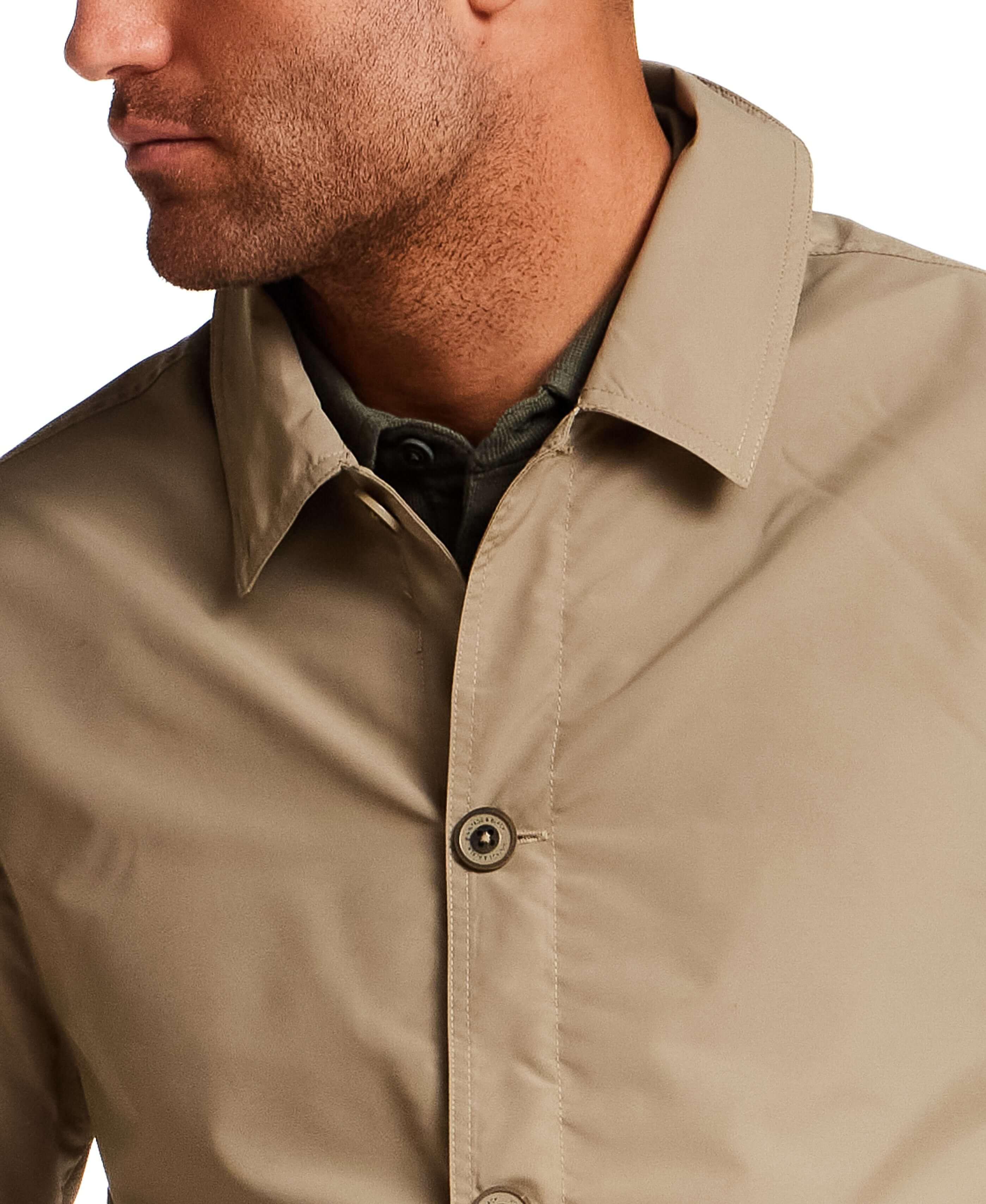 Mid Length Commuter Trench in Khaki with clean lines and structured collar, ideal for transitional layering.