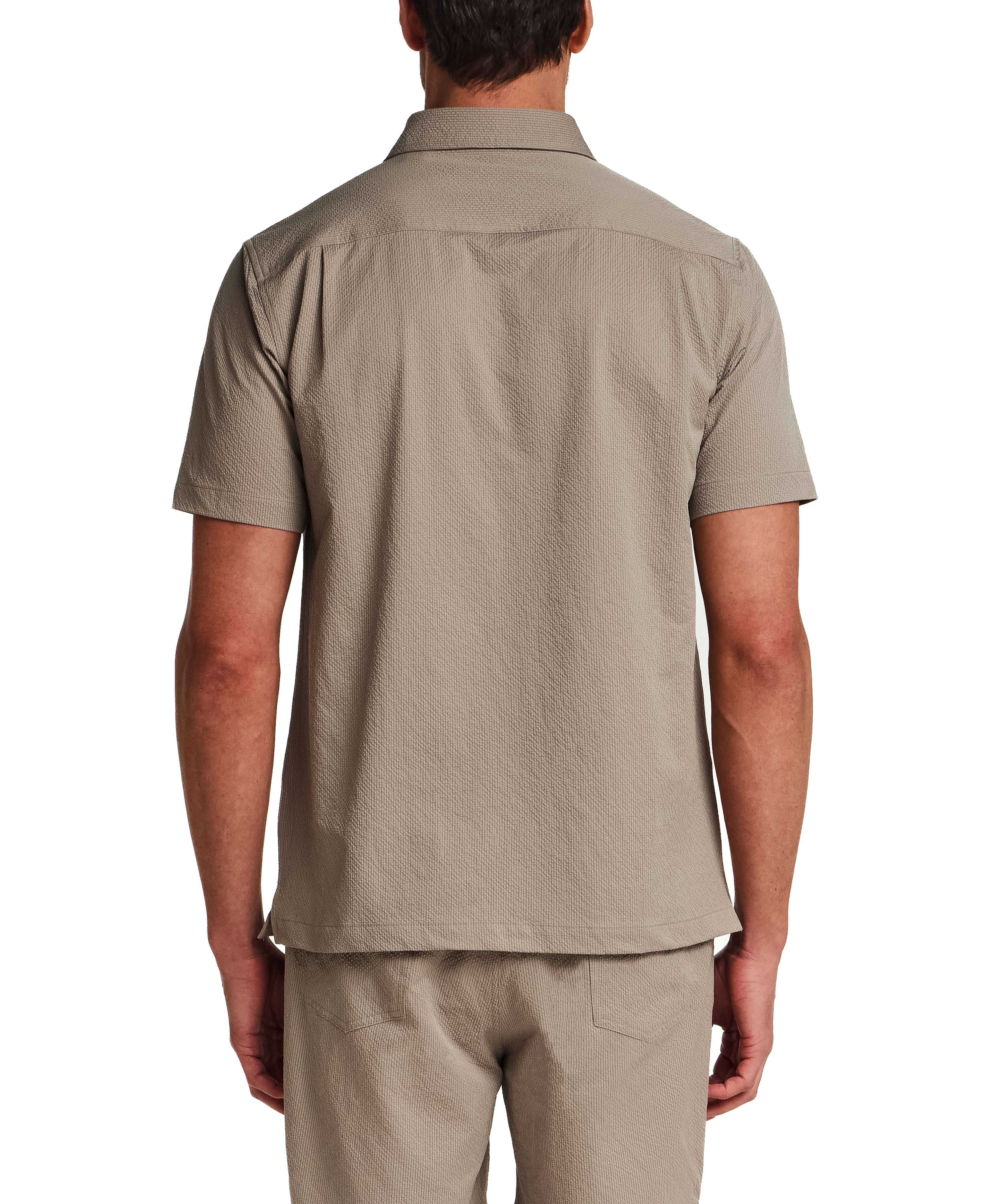 Back view of Mini Seersucker Shirt in Khaki, showcasing lightweight seersucker texture and structured collar.