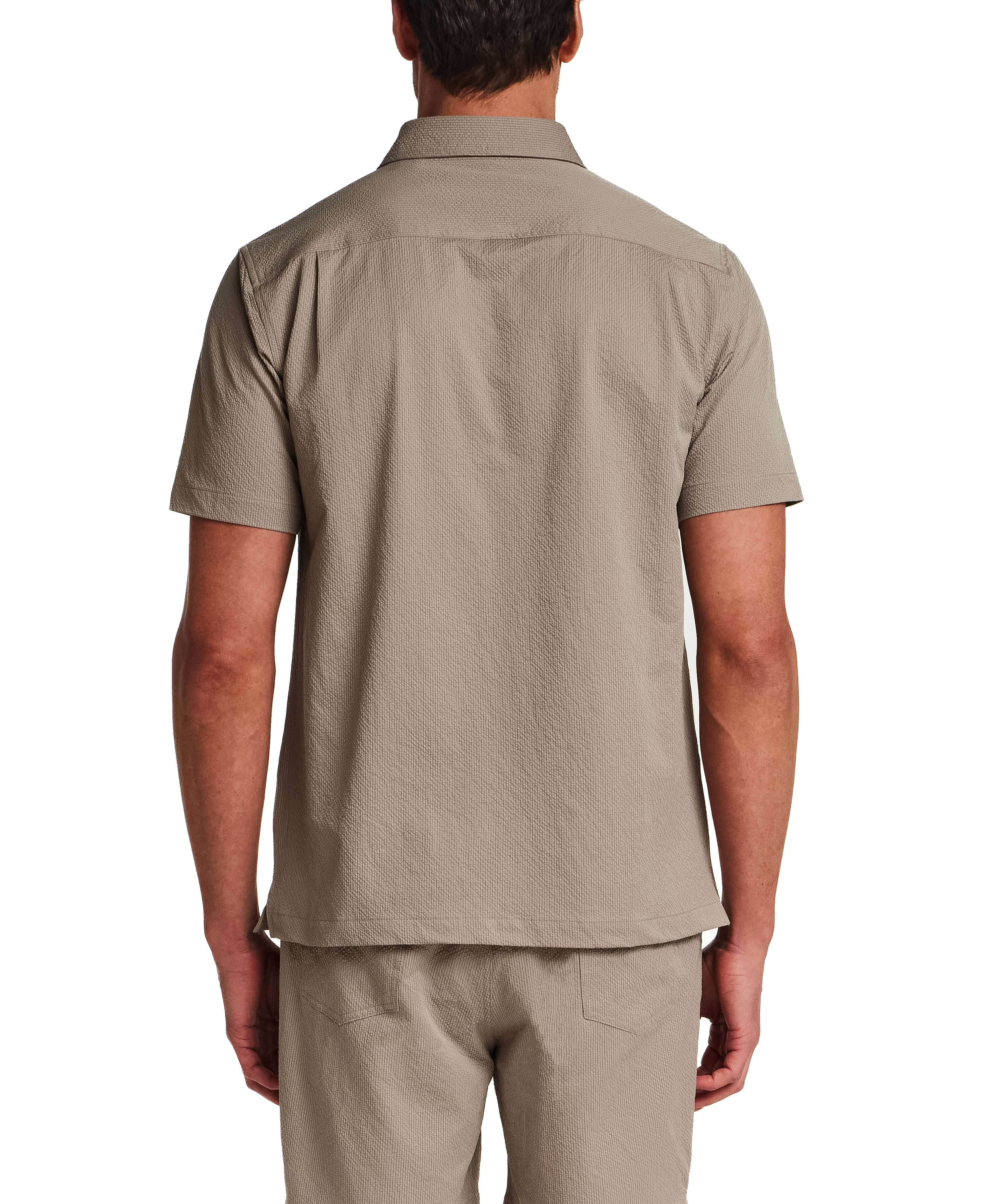 Back view of Mini Seersucker Shirt in Khaki, showcasing lightweight seersucker texture and structured collar.