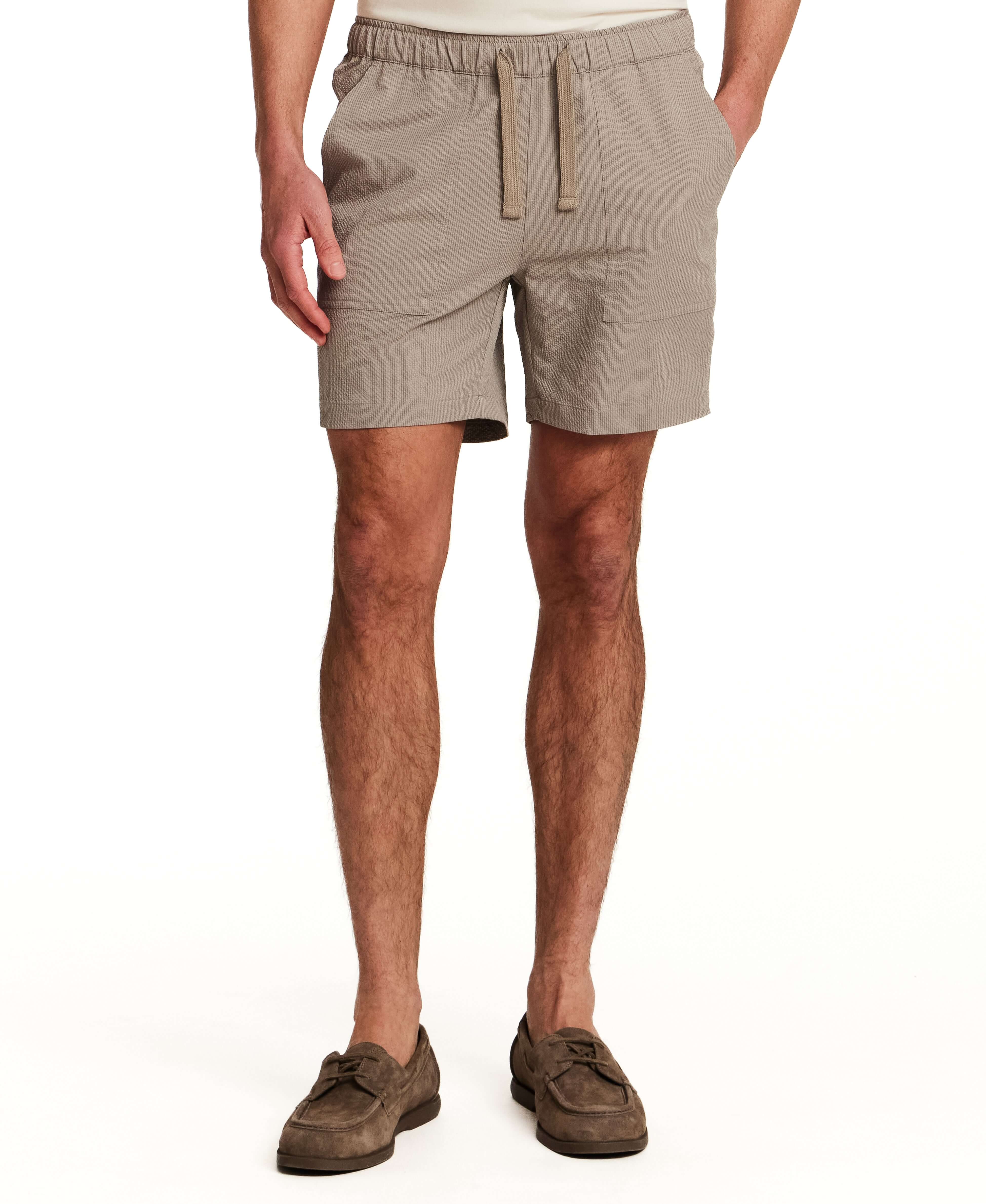 Mini Seersucker Short in Khaki worn by a model, showcasing the lightweight and tailored design.