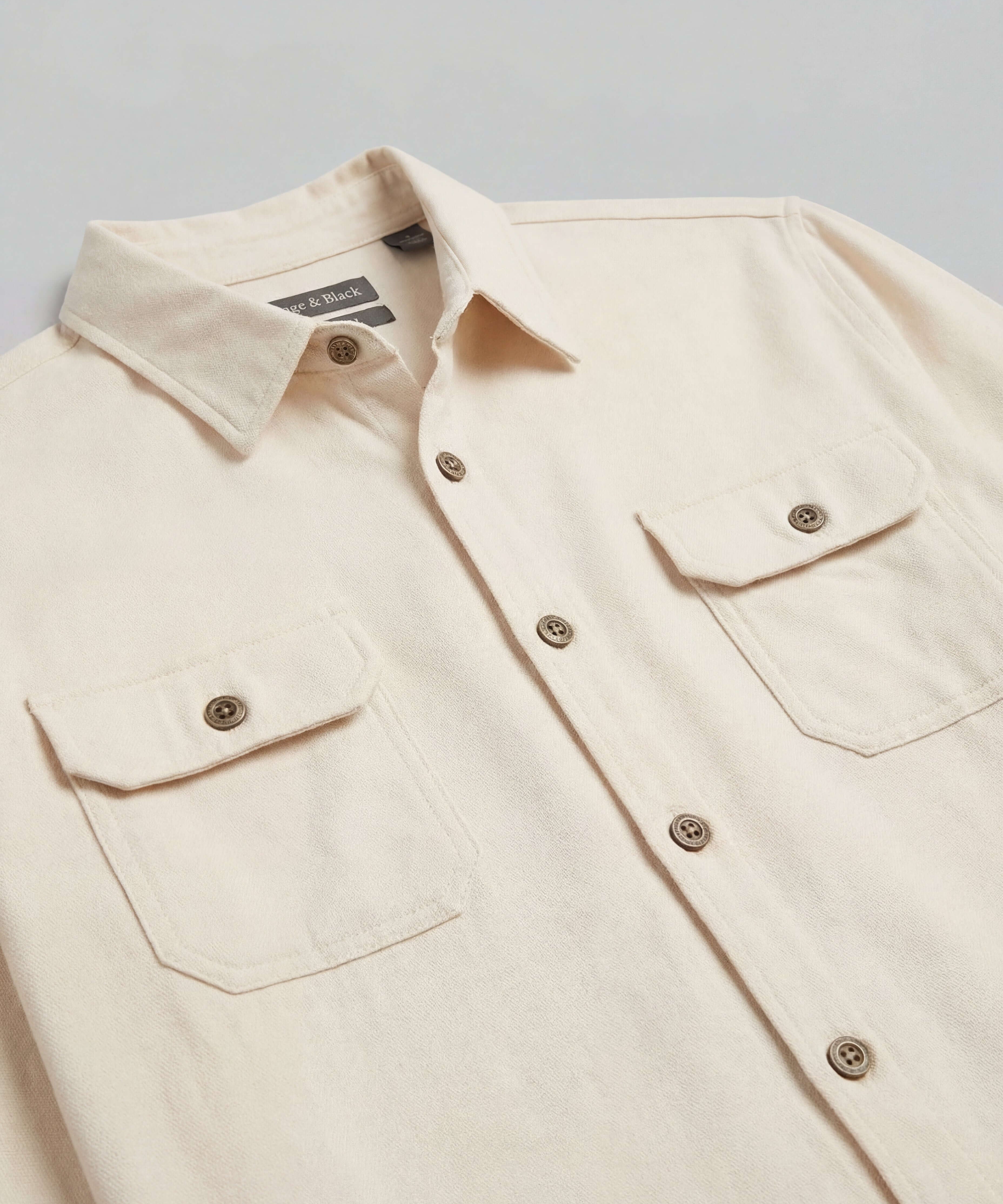 The Utility Shirt in Natural featuring a clean design, button front, and flap chest pockets for everyday wear.