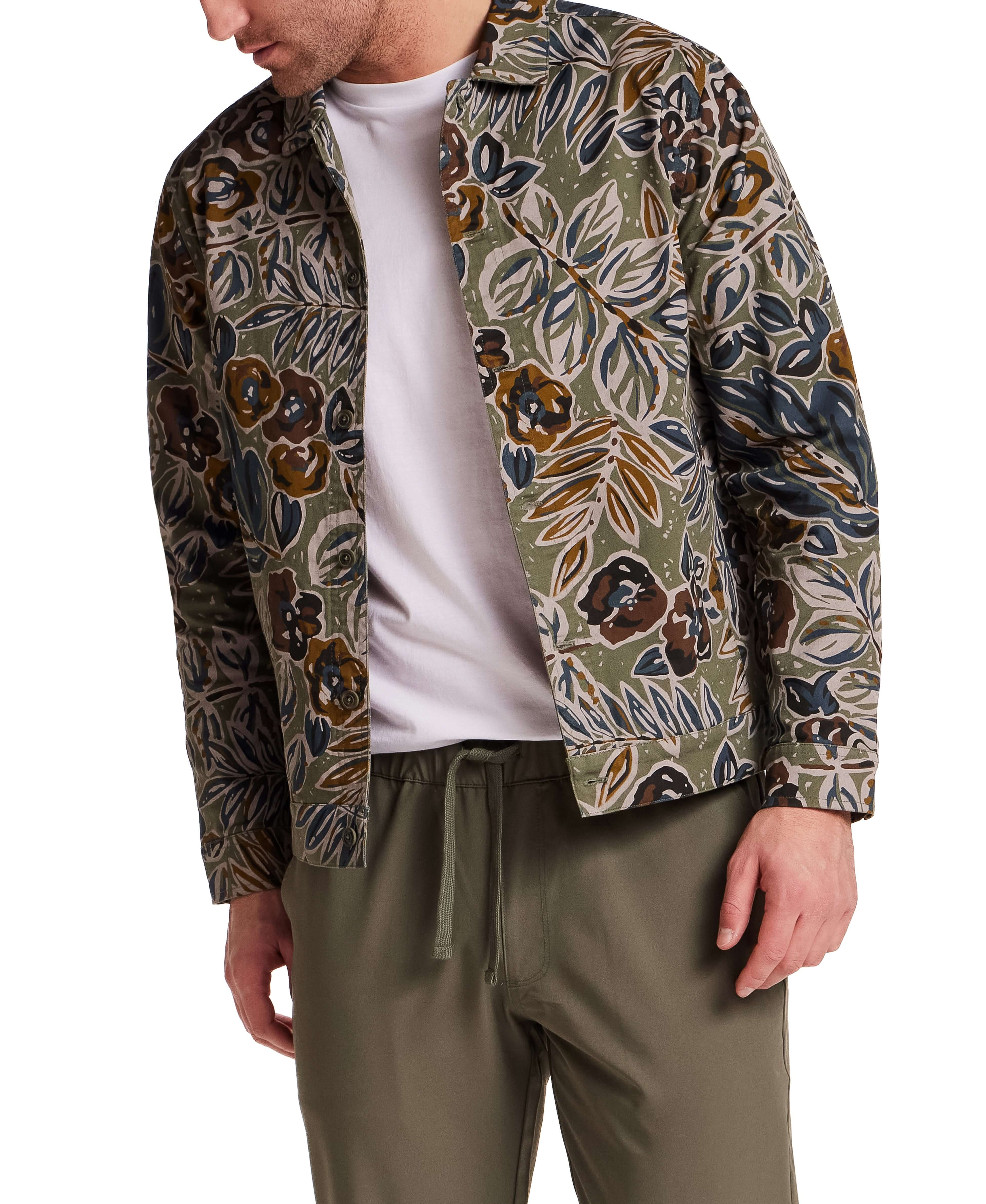 Floral Print Twill Trucker in Olive, featuring muted floral print and structured collar, styled with simple white tee and pants.