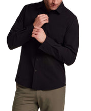 Model wearing a black Seersucker Shirt in Black, showcasing its tailored design and textured fabric.
