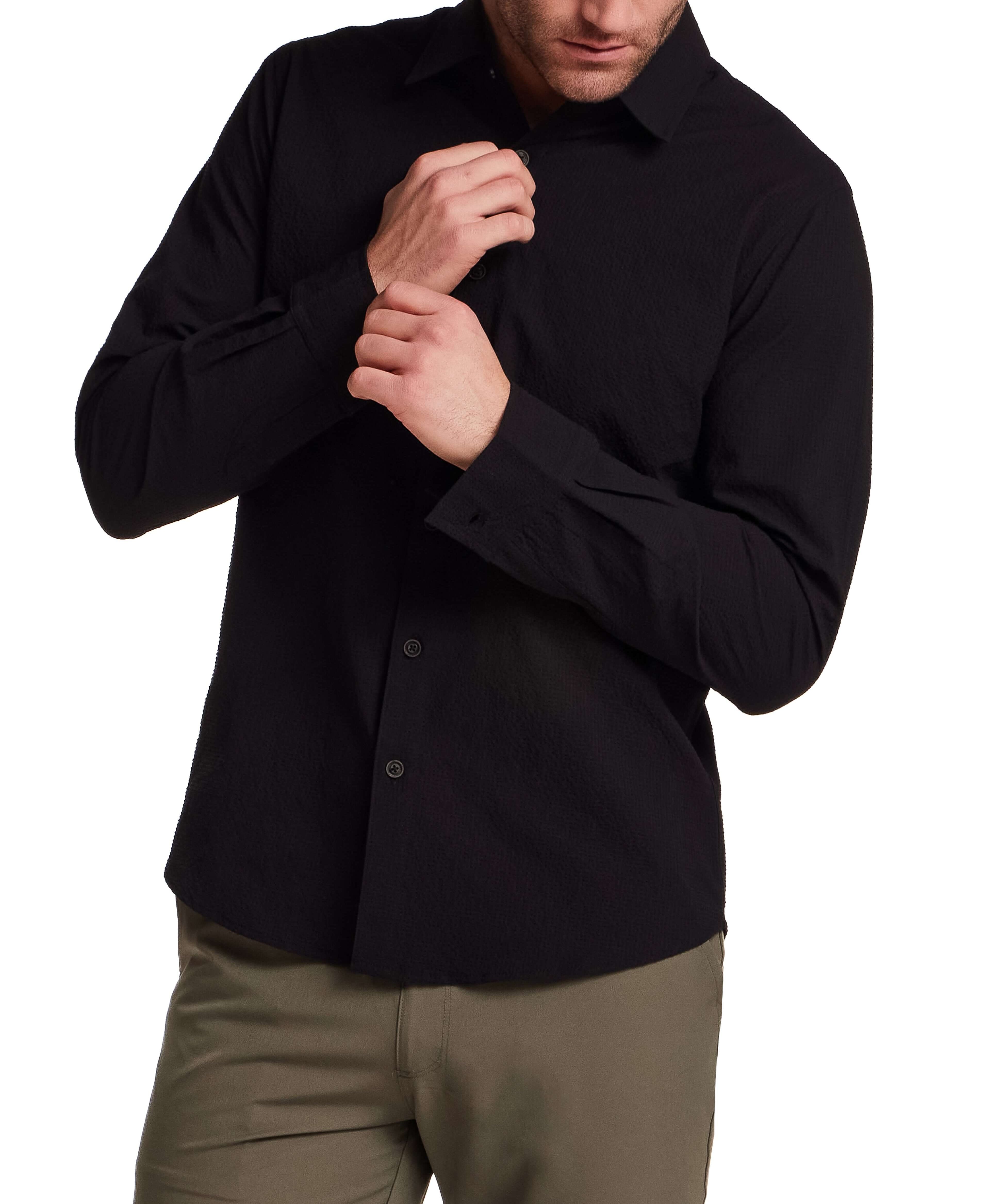 Model wearing a black Seersucker Shirt in Black, showcasing its tailored design and textured fabric.
