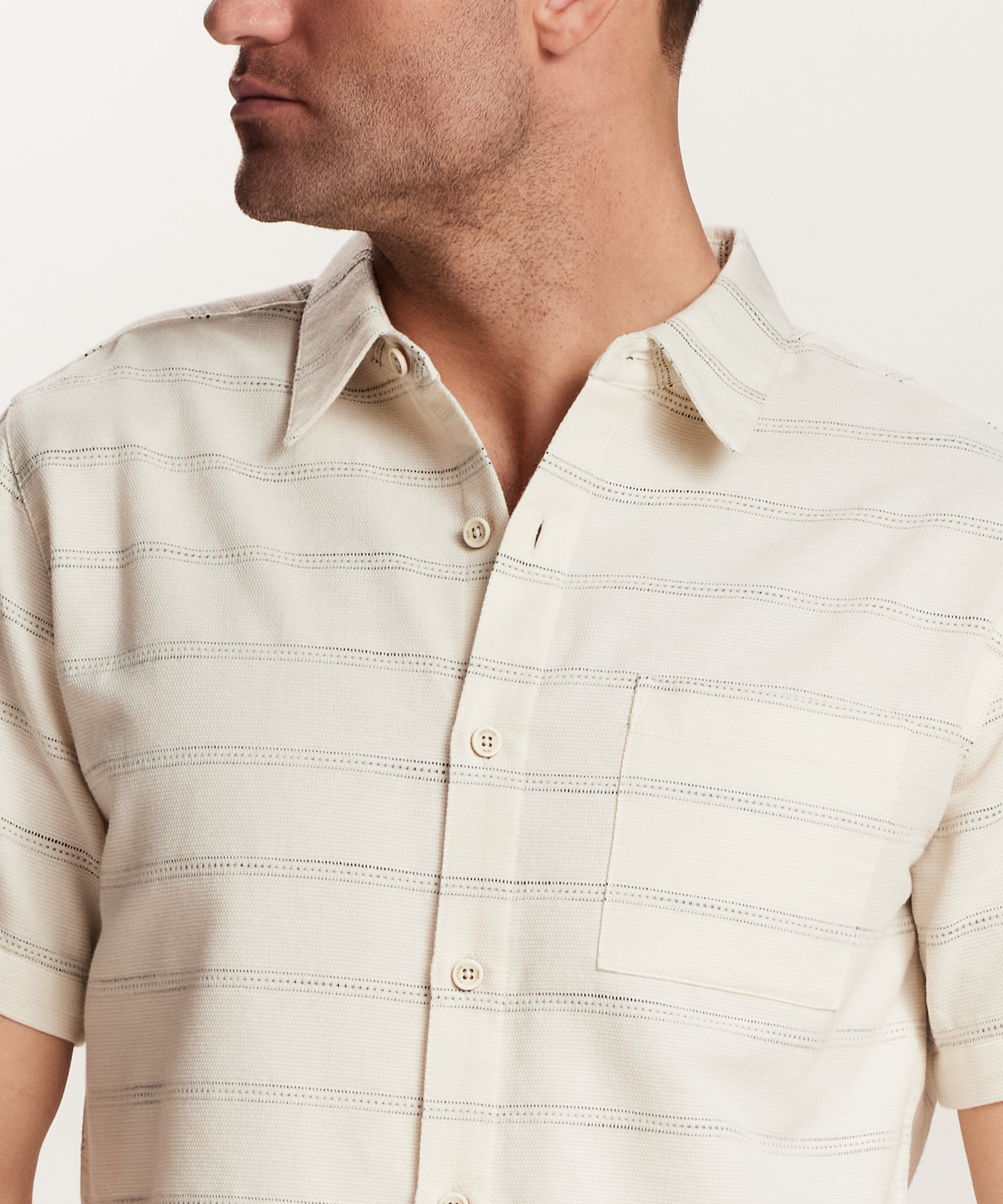 Textured Horizontal Stripe Button-Down Shirt in Turtle Dove worn by a man, showcasing a relaxed fit and vintage style.