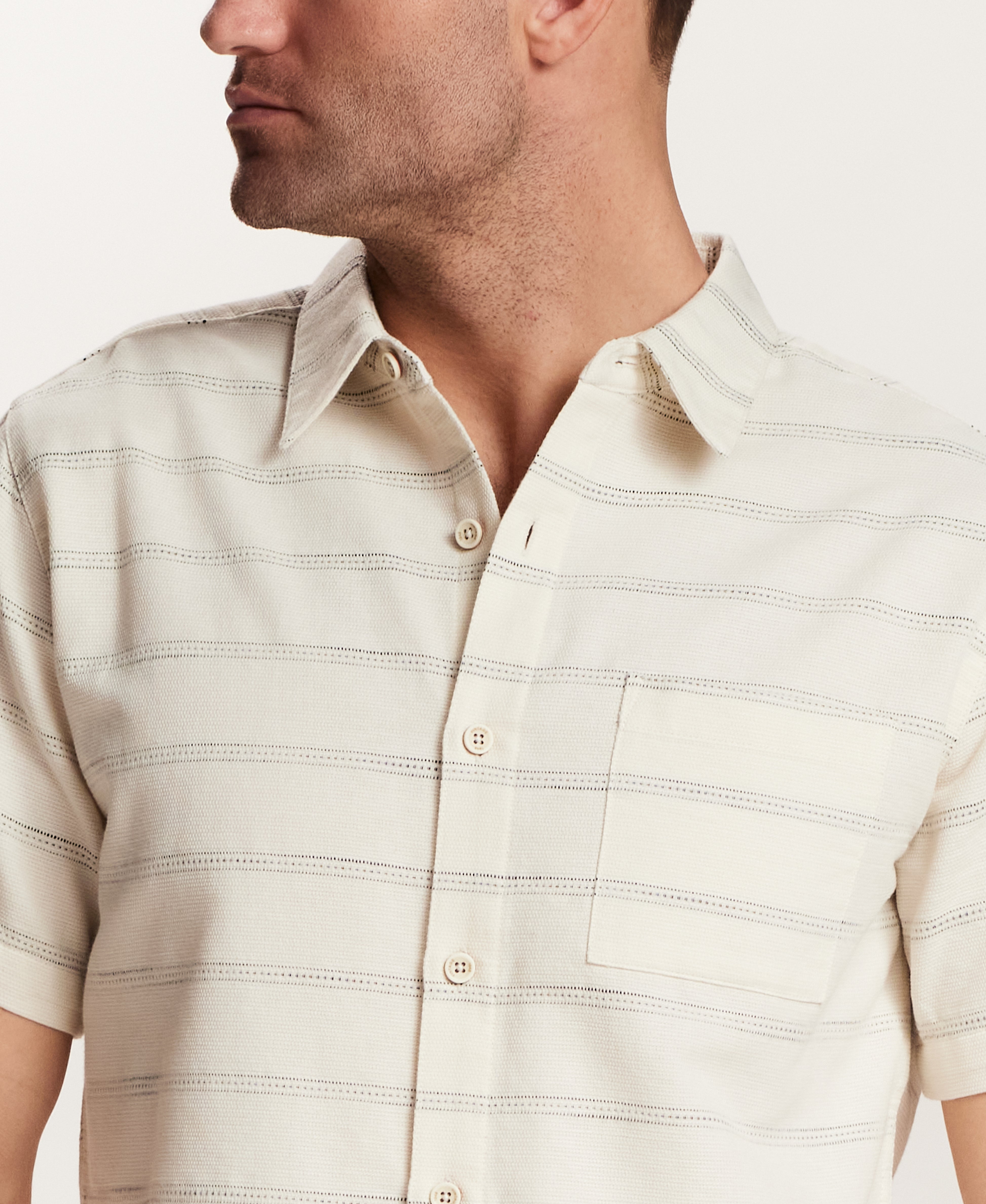Textured Horizontal Stripe Button-Down Shirt in Turtle Dove worn by a man, showcasing a relaxed fit and vintage style.