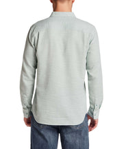 Back view of a man wearing Pebble Dobby Button-Down Shirt in Sea Grass, showcasing the textured cotton fabric and regular fit.
