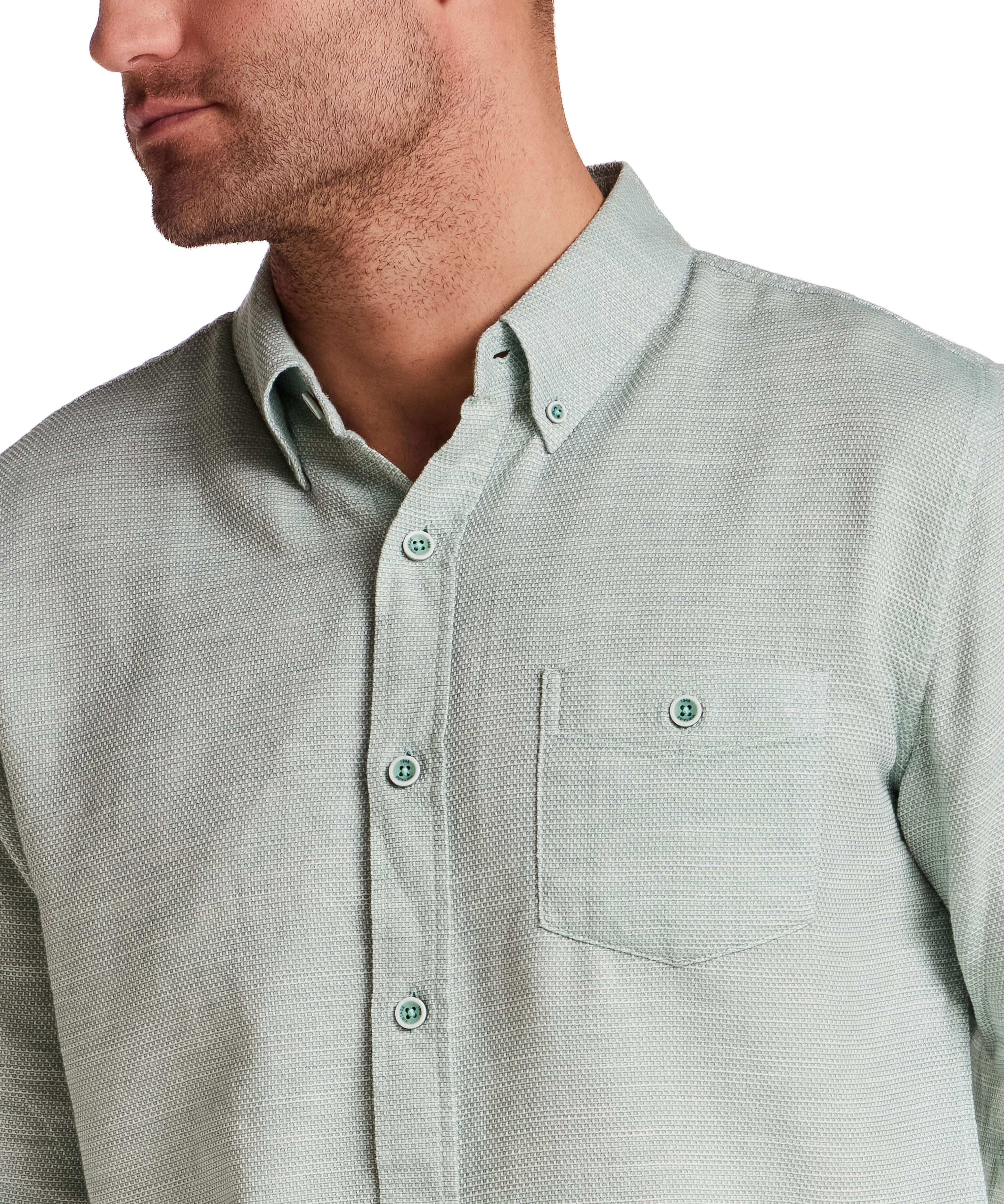 Pebble Dobby Button-Down Shirt in Sea Grass displayed on a model, highlighting its textured fabric and button details.